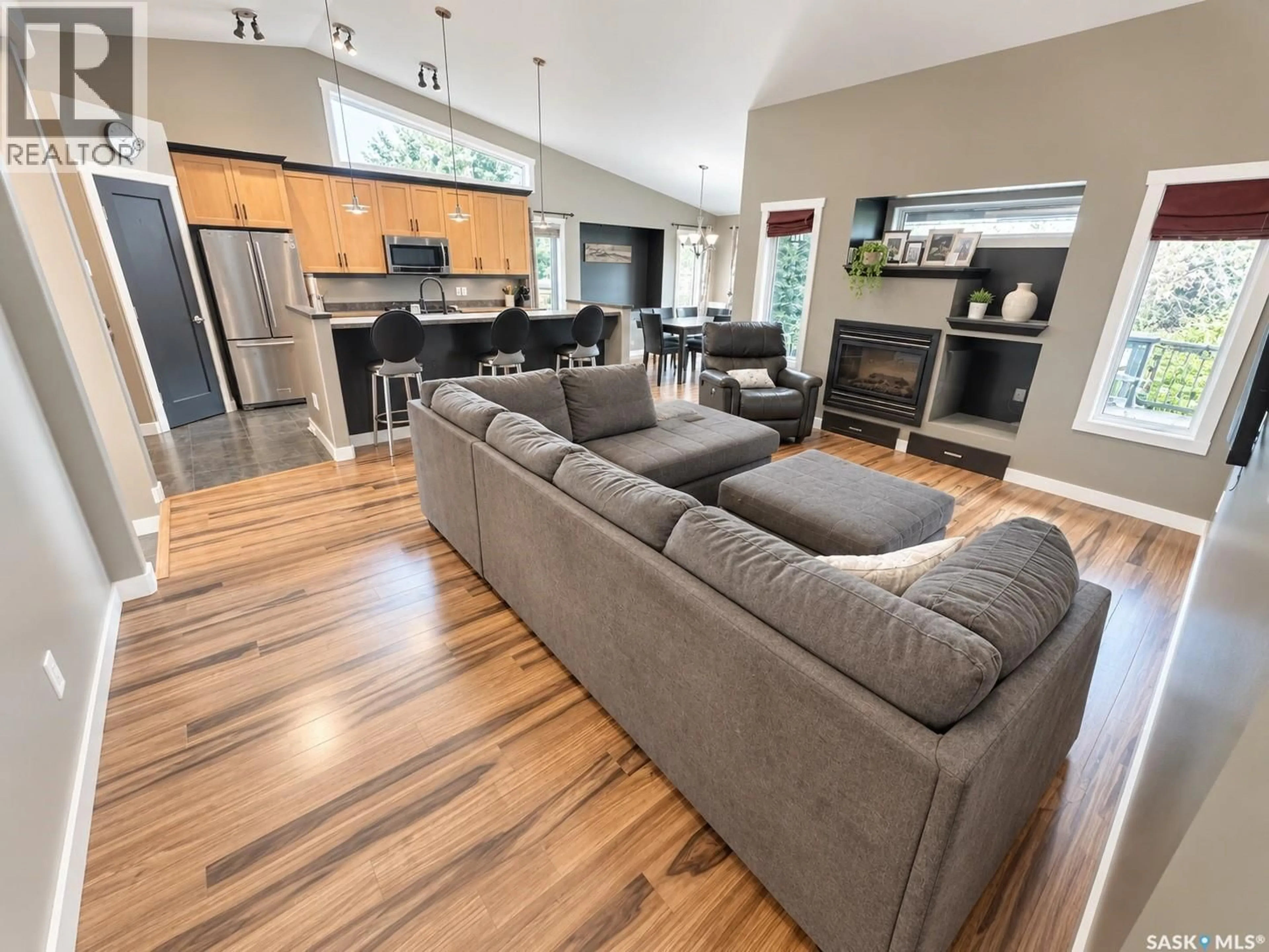 Open concept kitchen, wood/laminate floor for 715 18TH STREET, Weyburn Saskatchewan S4H3M2