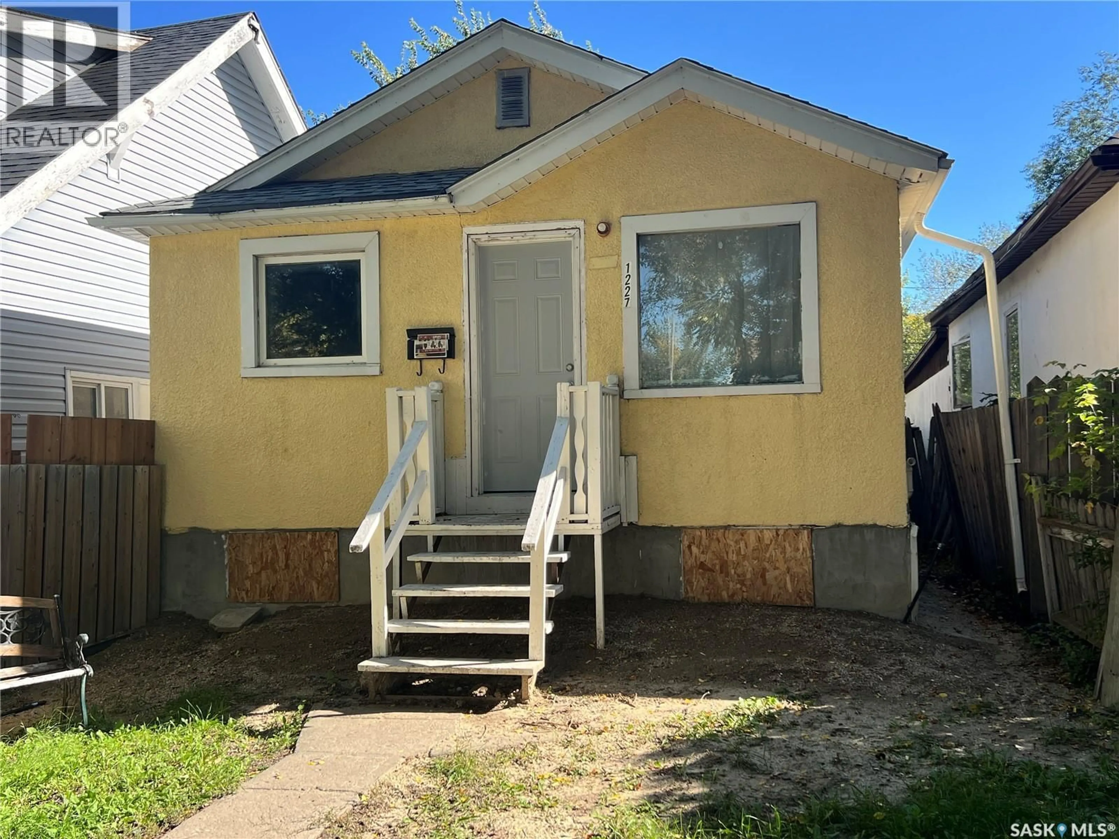 Home with vinyl exterior material, street for 1227 WASCANA STREET, Regina Saskatchewan S4T4J2
