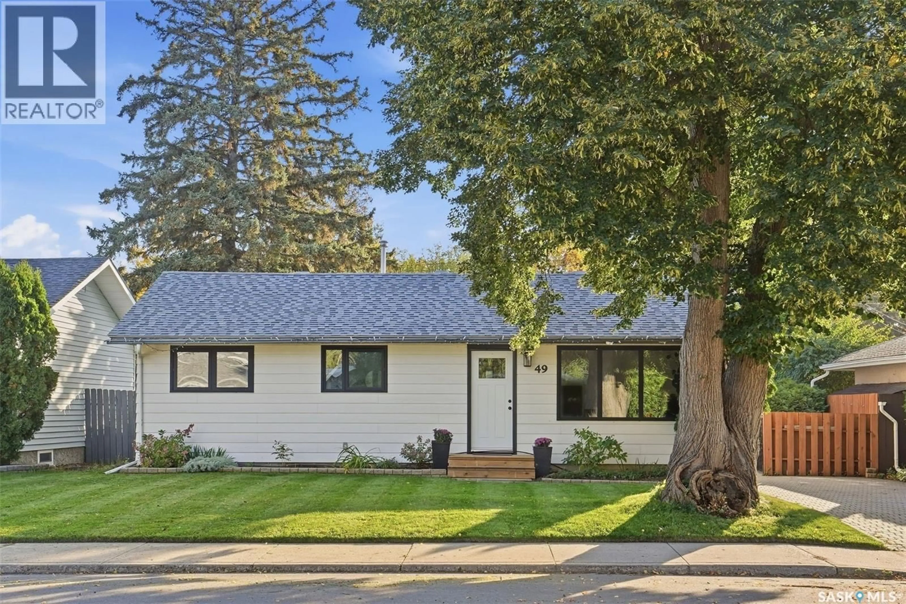 Home with vinyl exterior material, street for 49 MACKENZIE CRESCENT, Saskatoon Saskatchewan S7J2R4