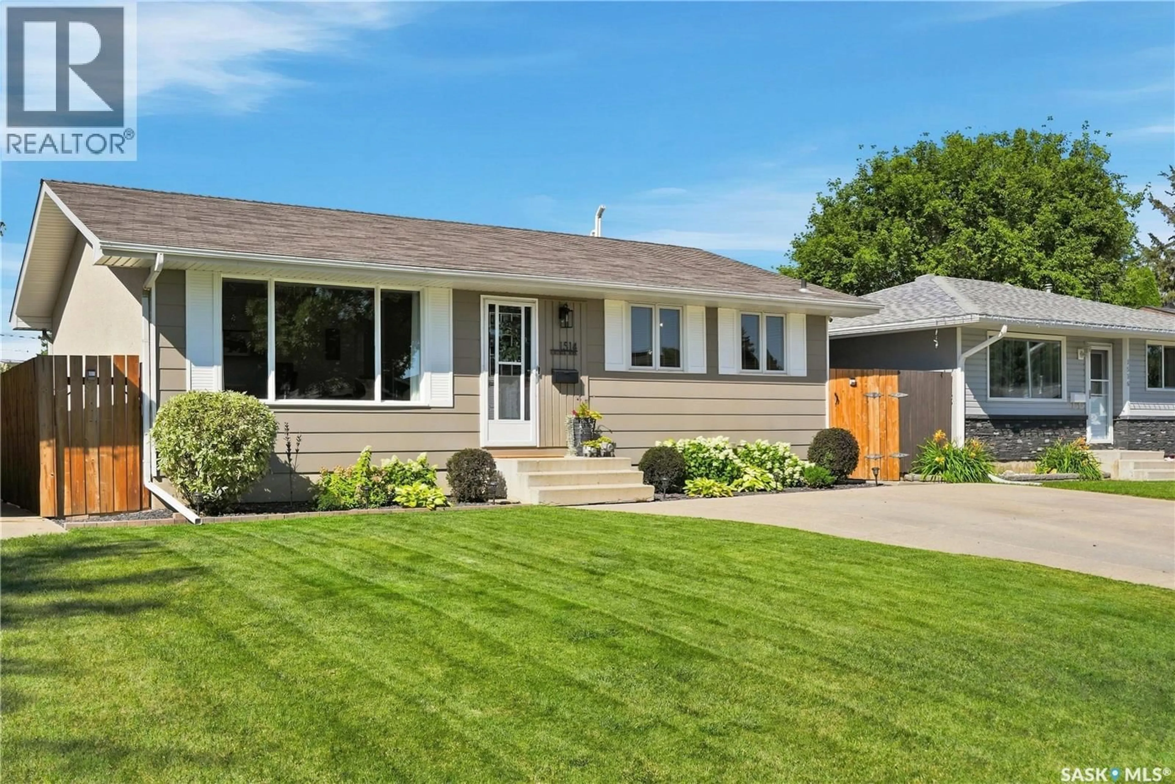 Home with vinyl exterior material, street for 1514 LAURA AVENUE, Saskatoon Saskatchewan S7N2S3