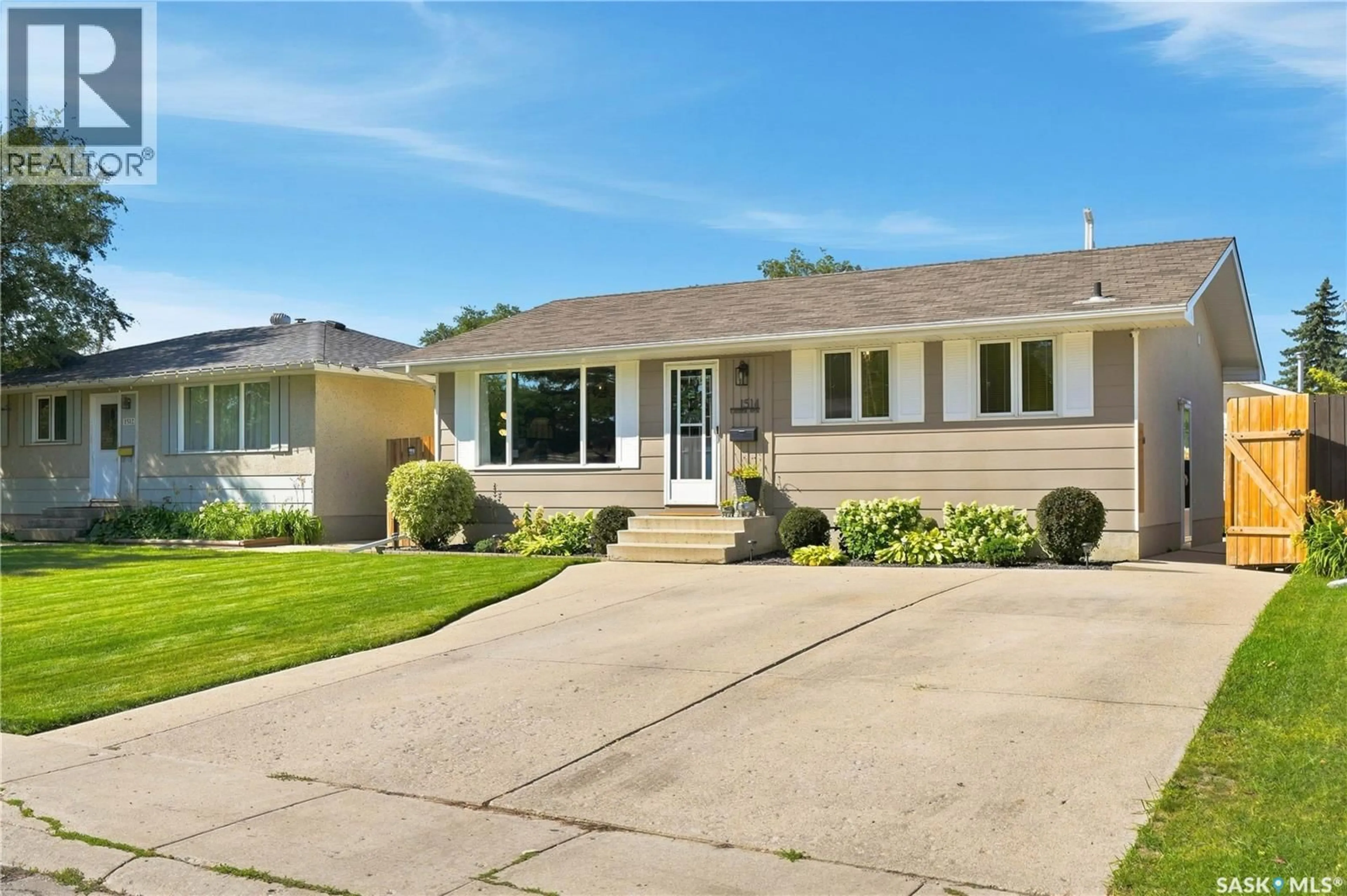 Home with vinyl exterior material, street for 1514 LAURA AVENUE, Saskatoon Saskatchewan S7N2S3