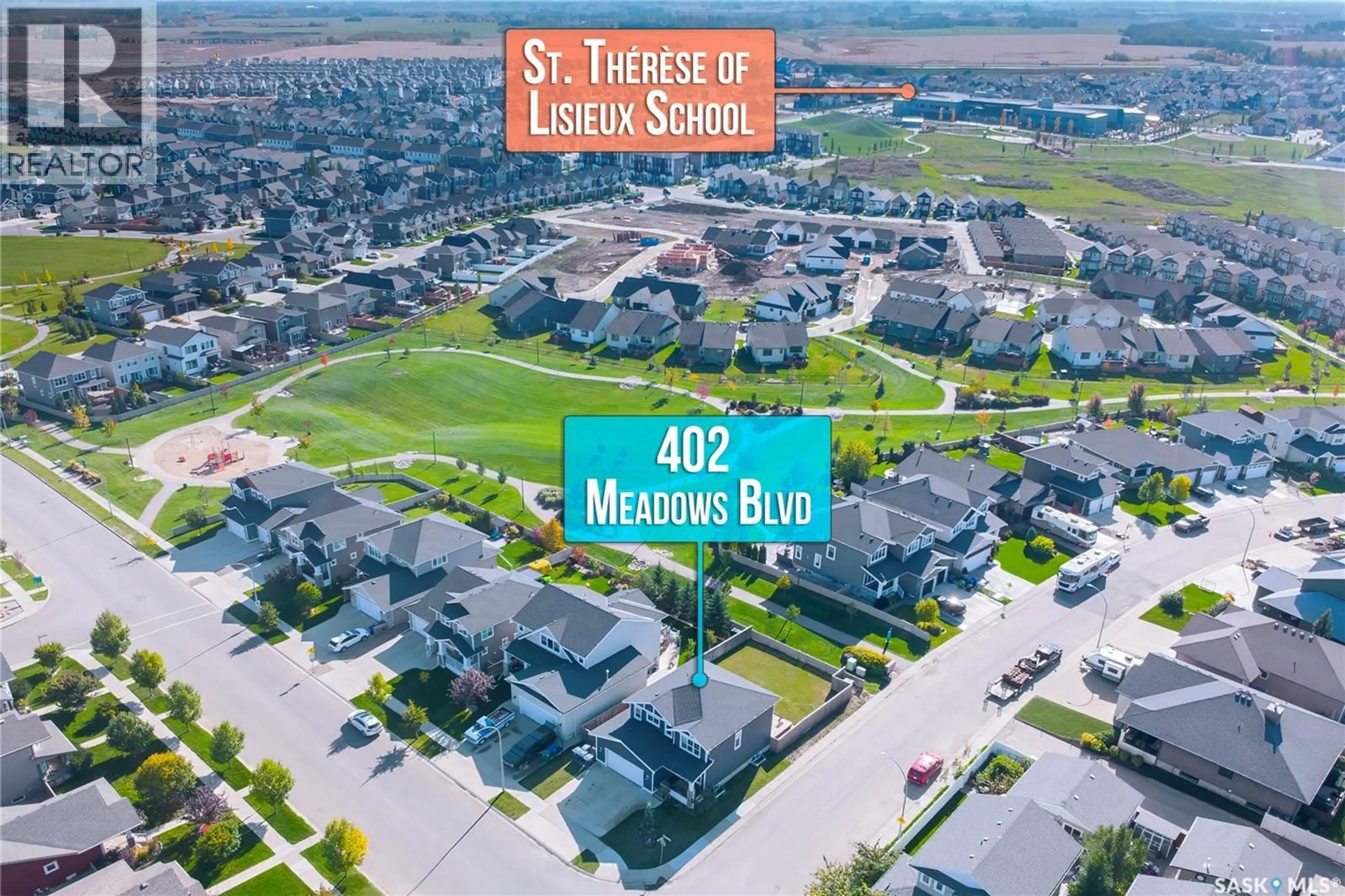 A pic from outside/outdoor area/front of a property/back of a property/a pic from drone, street for 402 MEADOWS BOULEVARD, Saskatoon Saskatchewan S7V0E7