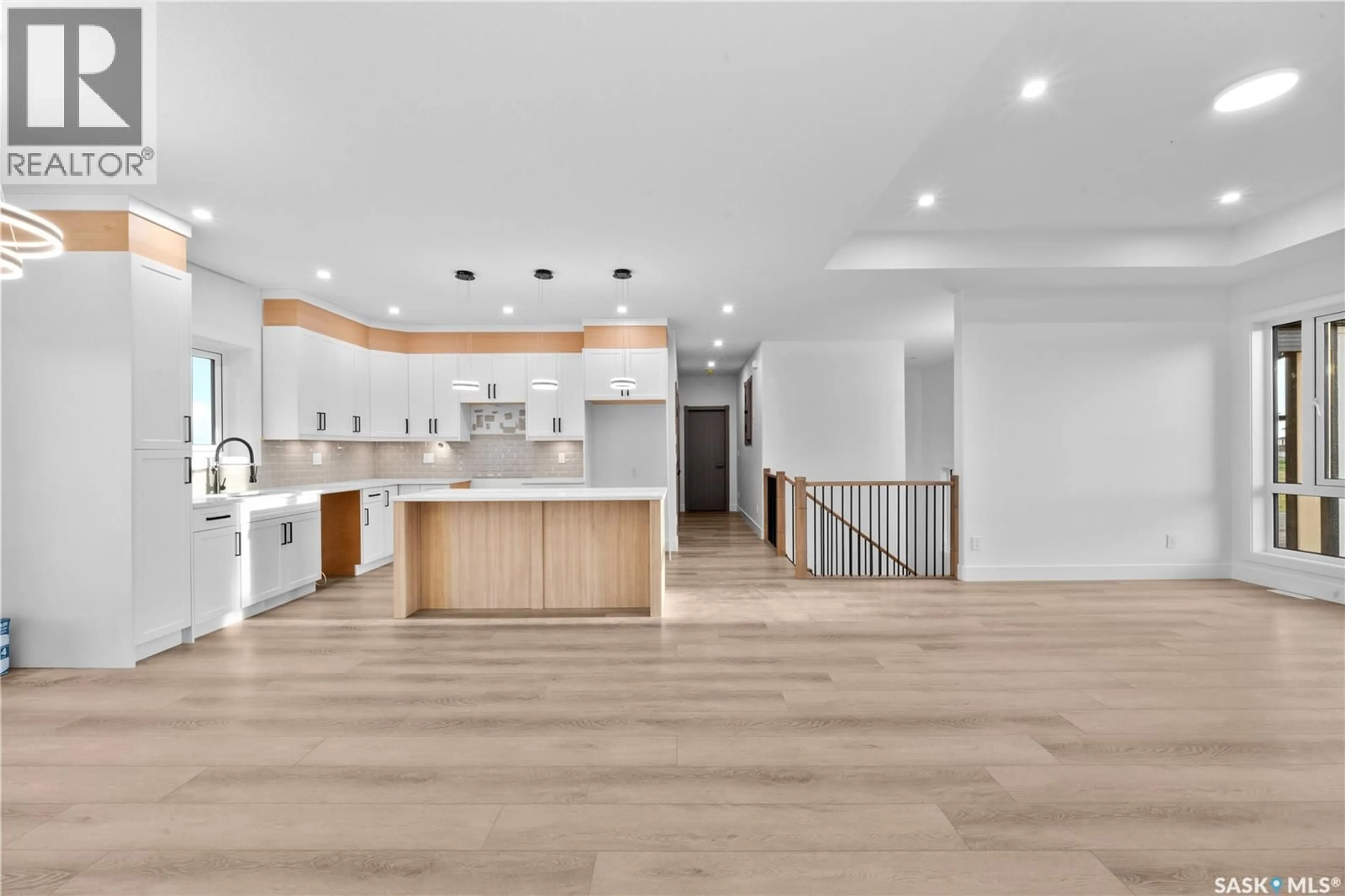 Open concept kitchen, wood/laminate floor for 8 CARDINAL DRIVE, Dundurn Rm No. 314 Saskatchewan S7C0C3