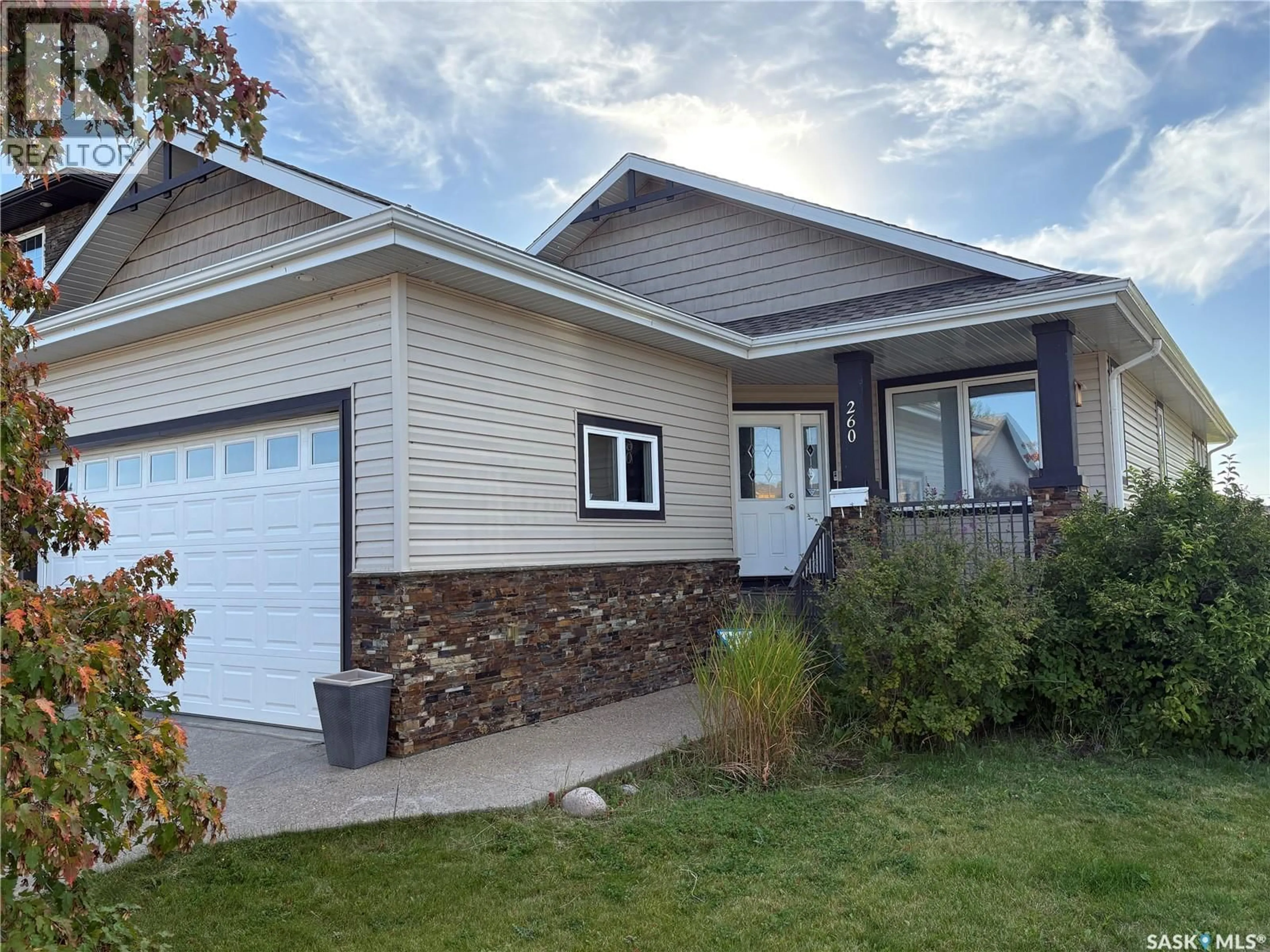 Home with vinyl exterior material, street for 206 THAUBERGER ROAD, Regina Saskatchewan S4Y0C3