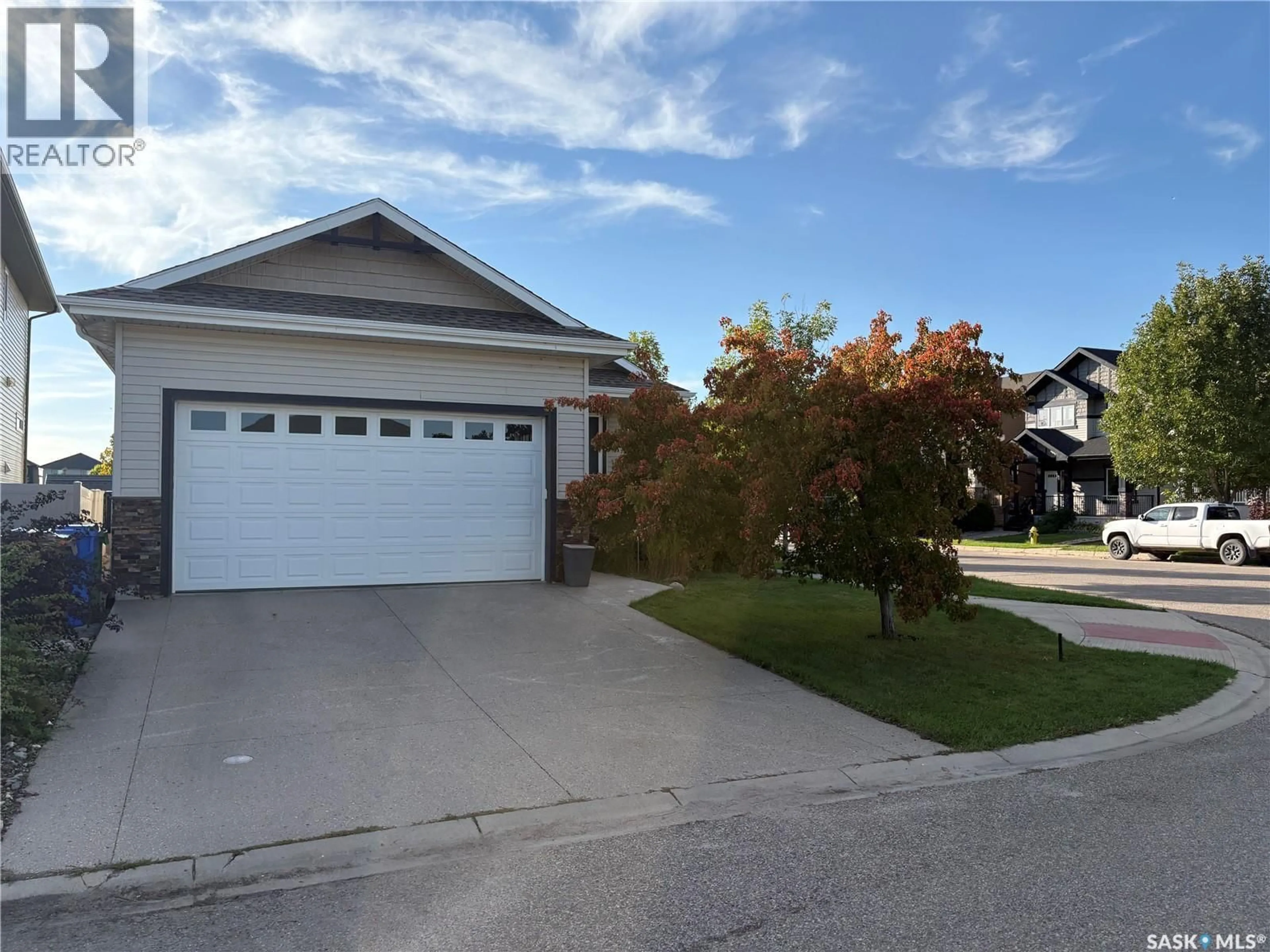 Home with vinyl exterior material, street for 206 THAUBERGER ROAD, Regina Saskatchewan S4Y0C3