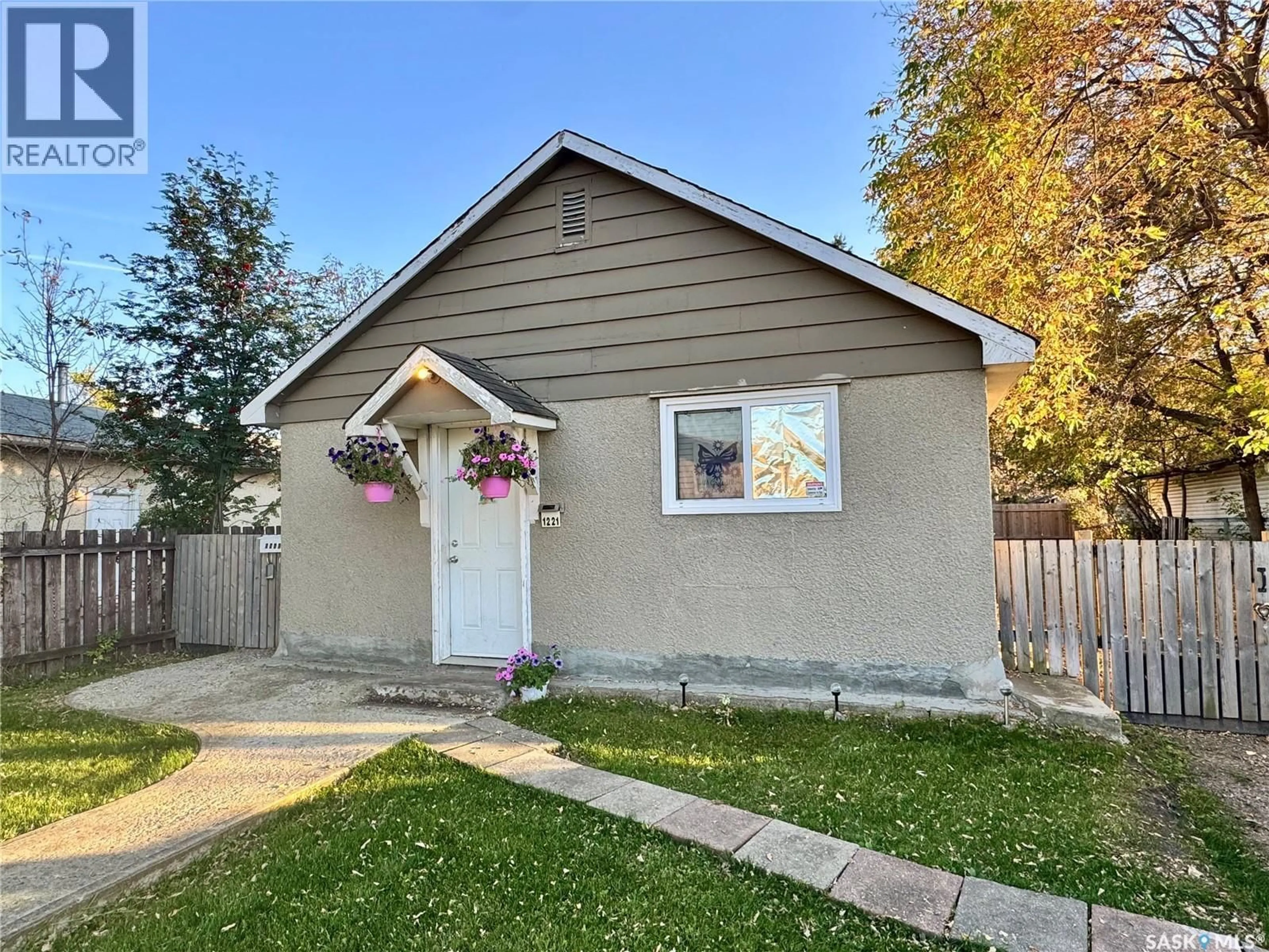 Home with vinyl exterior material, street for 1221 14TH STREET, Prince Albert Saskatchewan S6V3M8