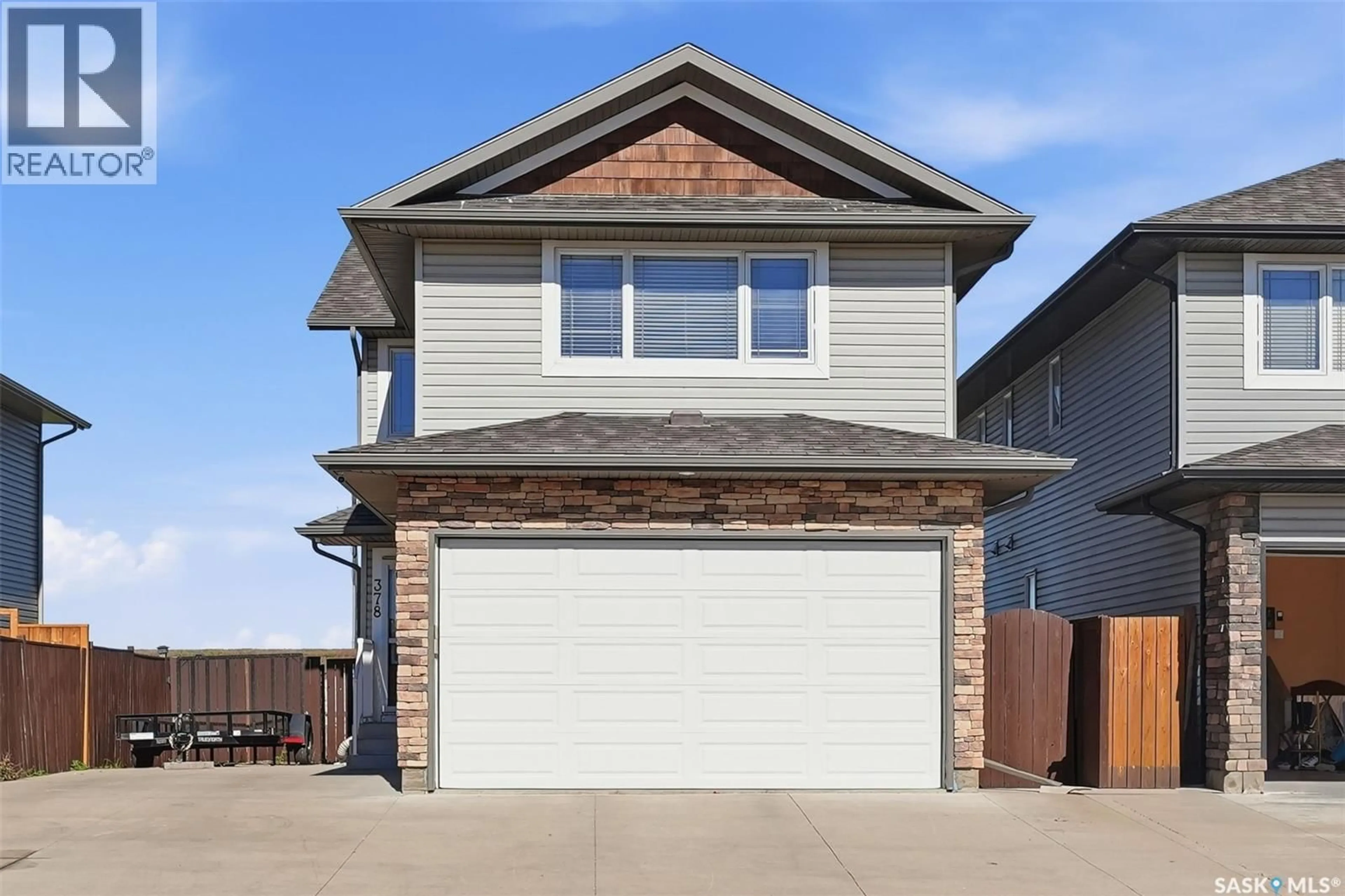 Home with vinyl exterior material, street for 378 COAD MANOR, Saskatoon Saskatchewan S7R0C6