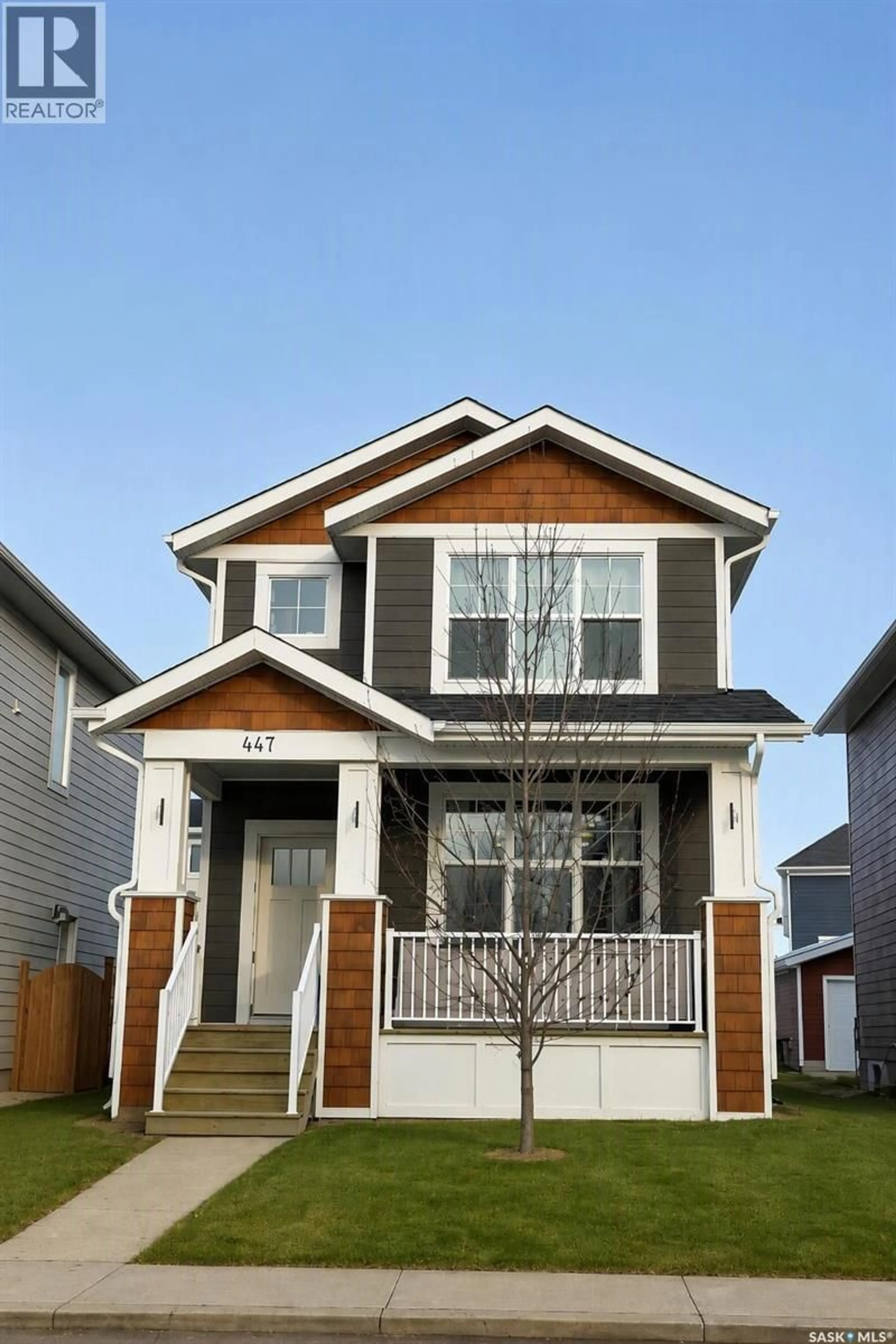 Home with vinyl exterior material, street for 447 EATON LANE, Saskatoon Saskatchewan S7V0H5