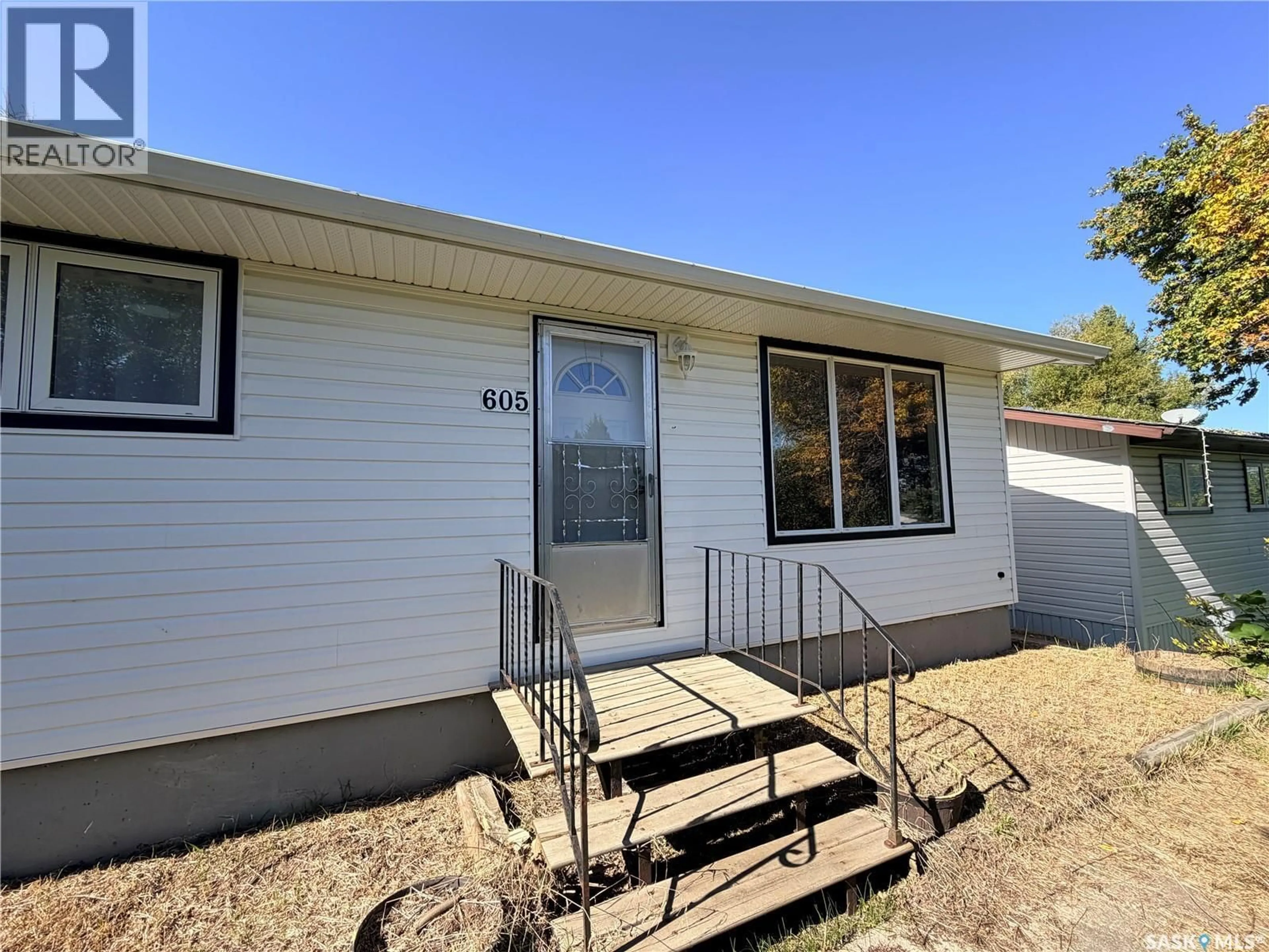 Home with vinyl exterior material, street for 605 HALL STREET, Kelvington Saskatchewan S0A1W0