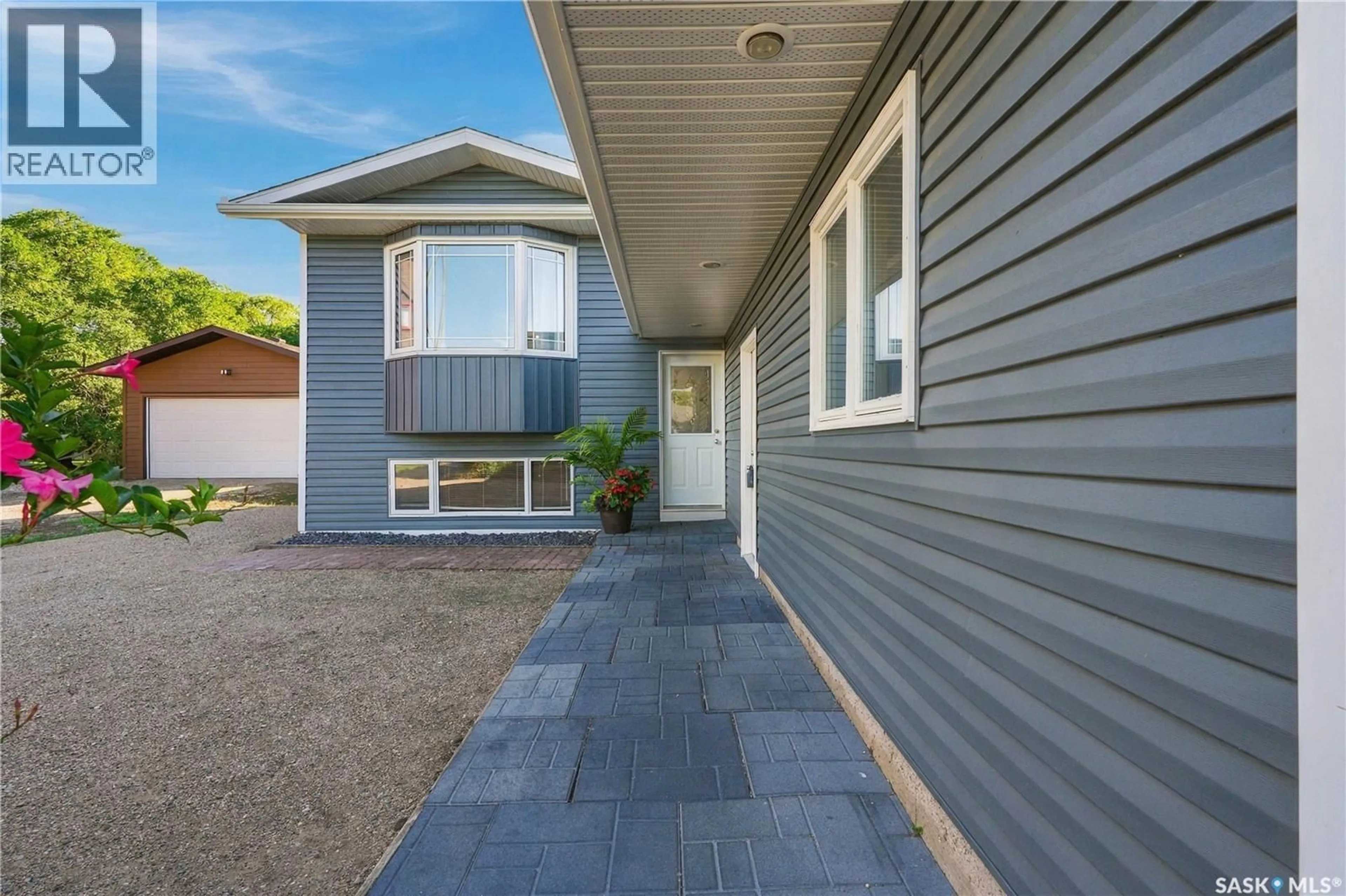 Home with vinyl exterior material, street for 345 CLARK AVENUE, Asquith Saskatchewan S0K0J0
