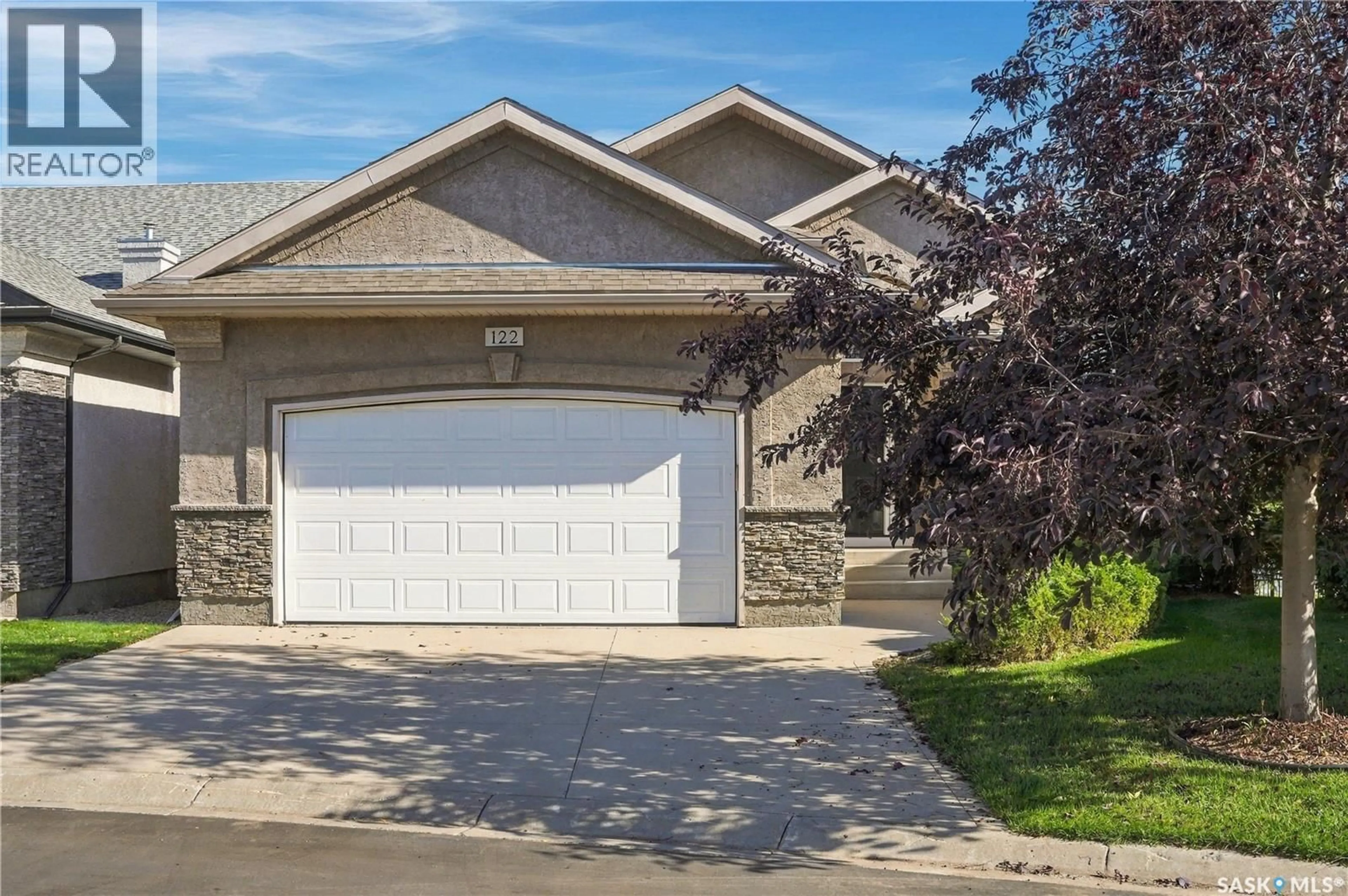 Home with vinyl exterior material, street for 122 201 CARTWRIGHT TERRACE, Saskatoon Saskatchewan S7T0A4