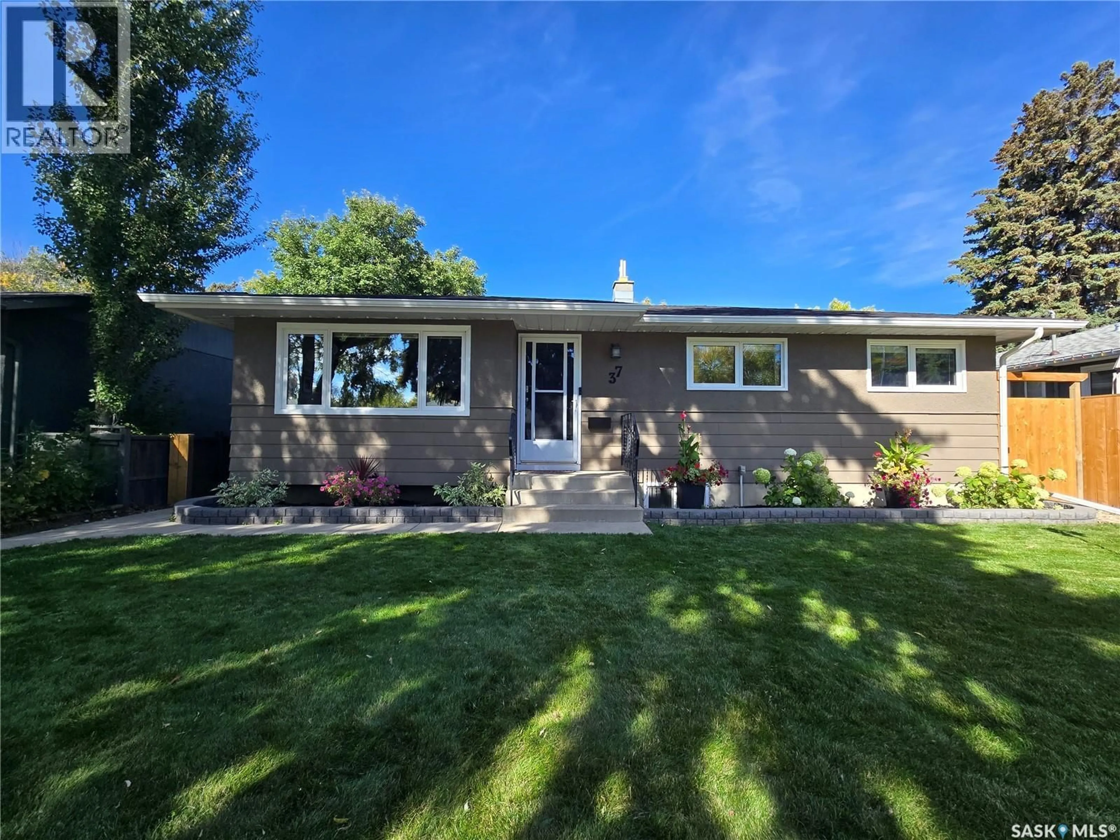 Home with vinyl exterior material, street for 37 DUNNING CRESCENT, Saskatoon Saskatchewan S7J2S6