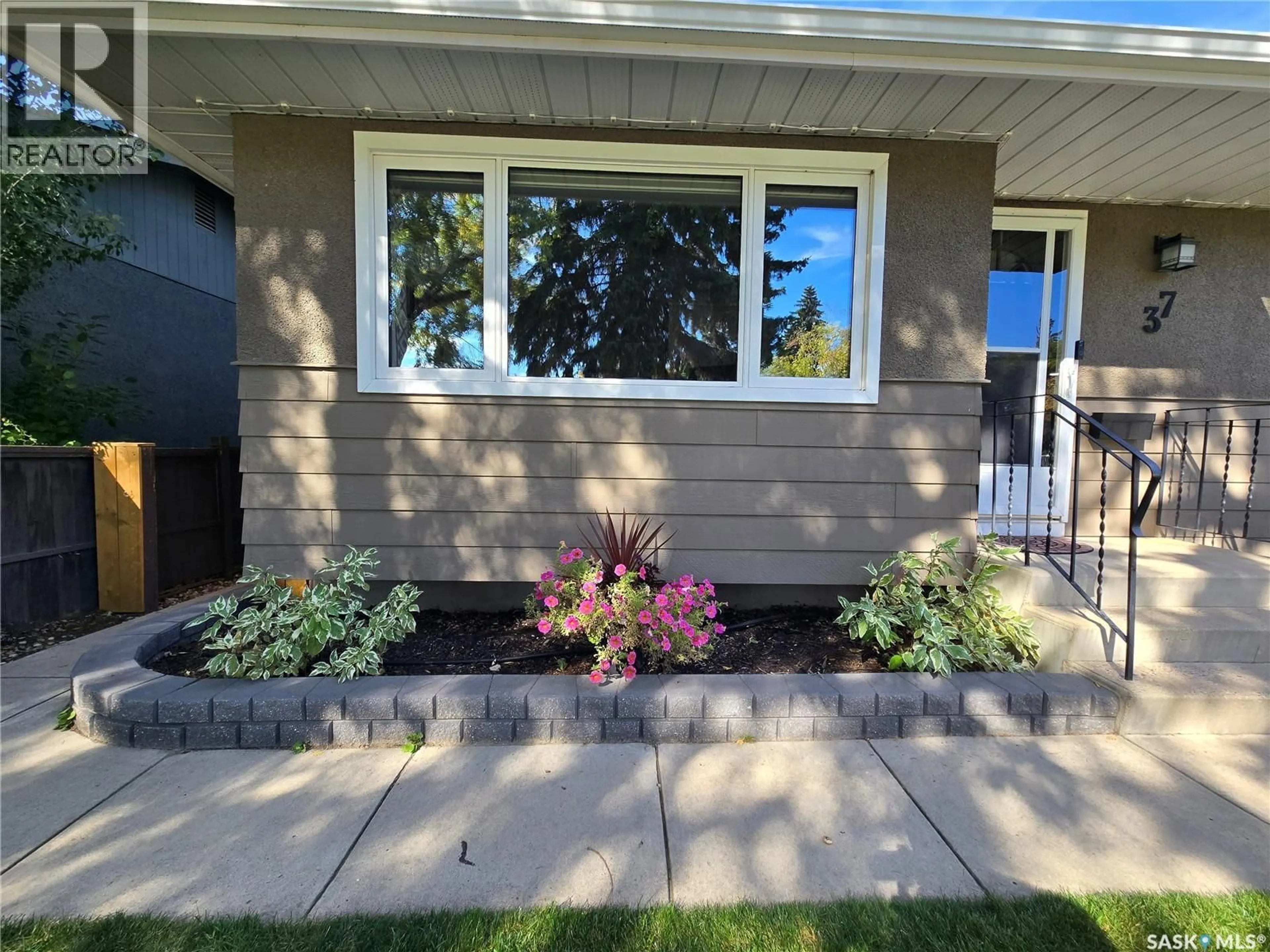 Home with vinyl exterior material, street for 37 DUNNING CRESCENT, Saskatoon Saskatchewan S7J2S6