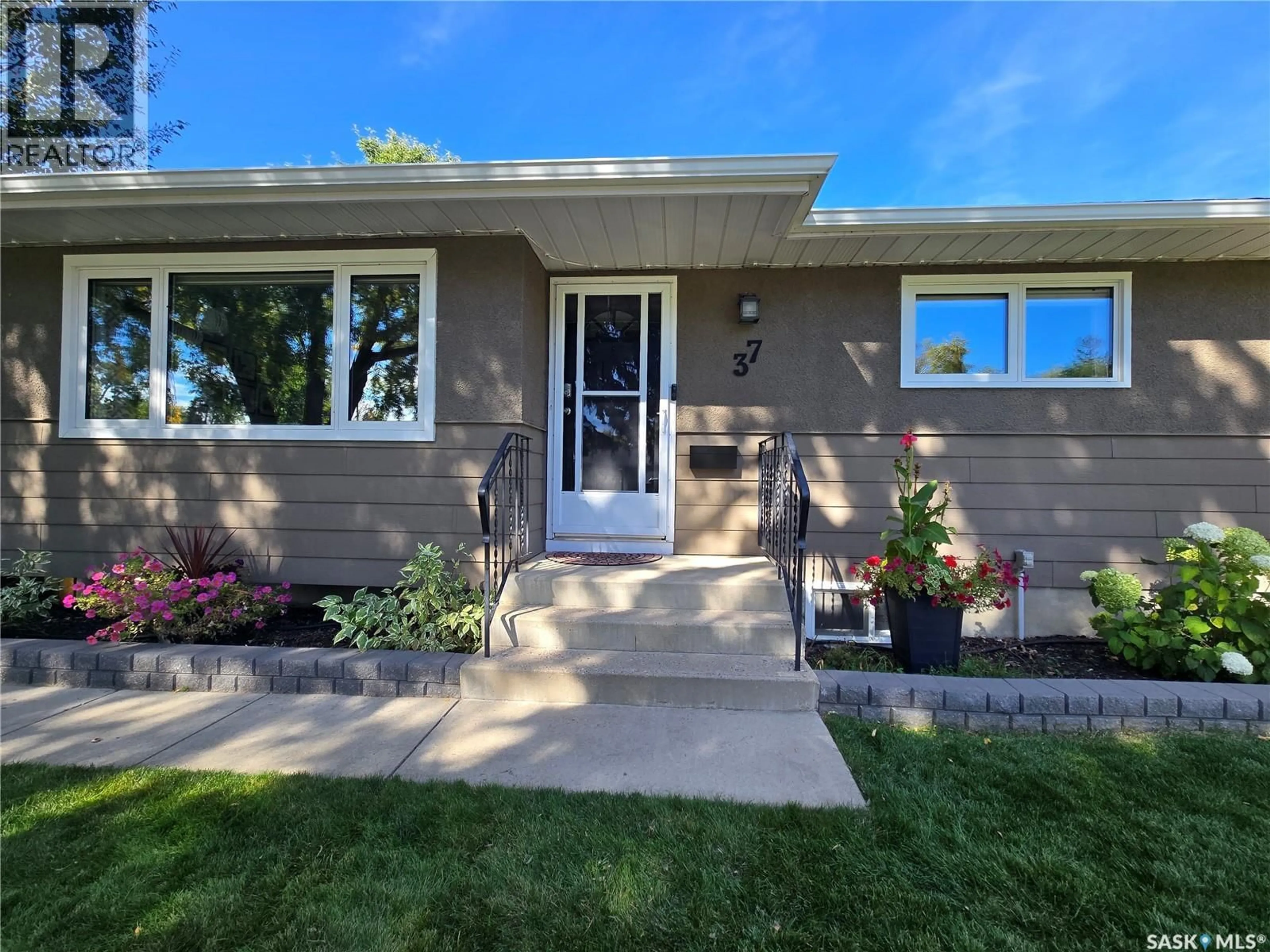 Home with vinyl exterior material, street for 37 DUNNING CRESCENT, Saskatoon Saskatchewan S7J2S6