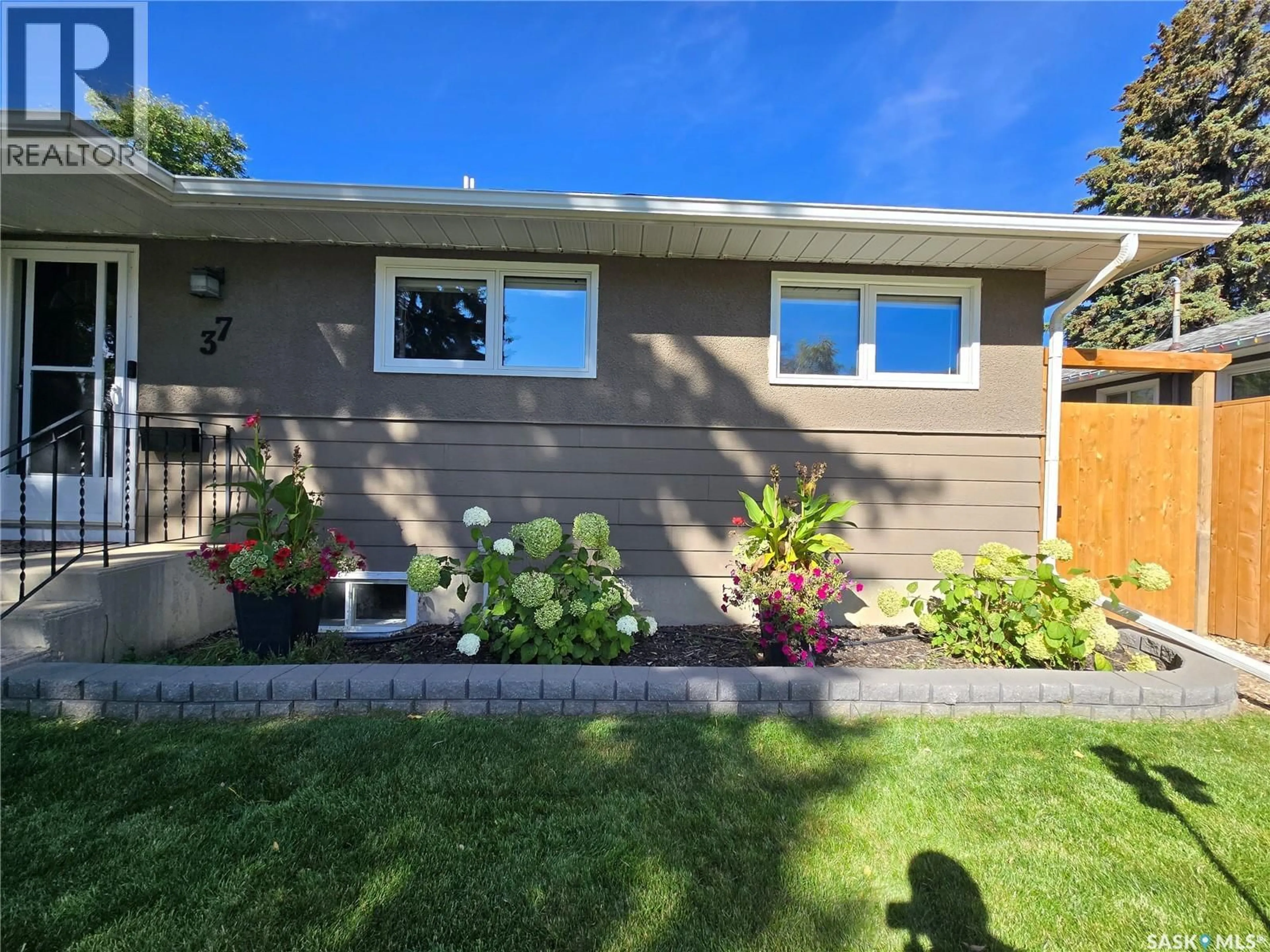 Home with vinyl exterior material, street for 37 DUNNING CRESCENT, Saskatoon Saskatchewan S7J2S6