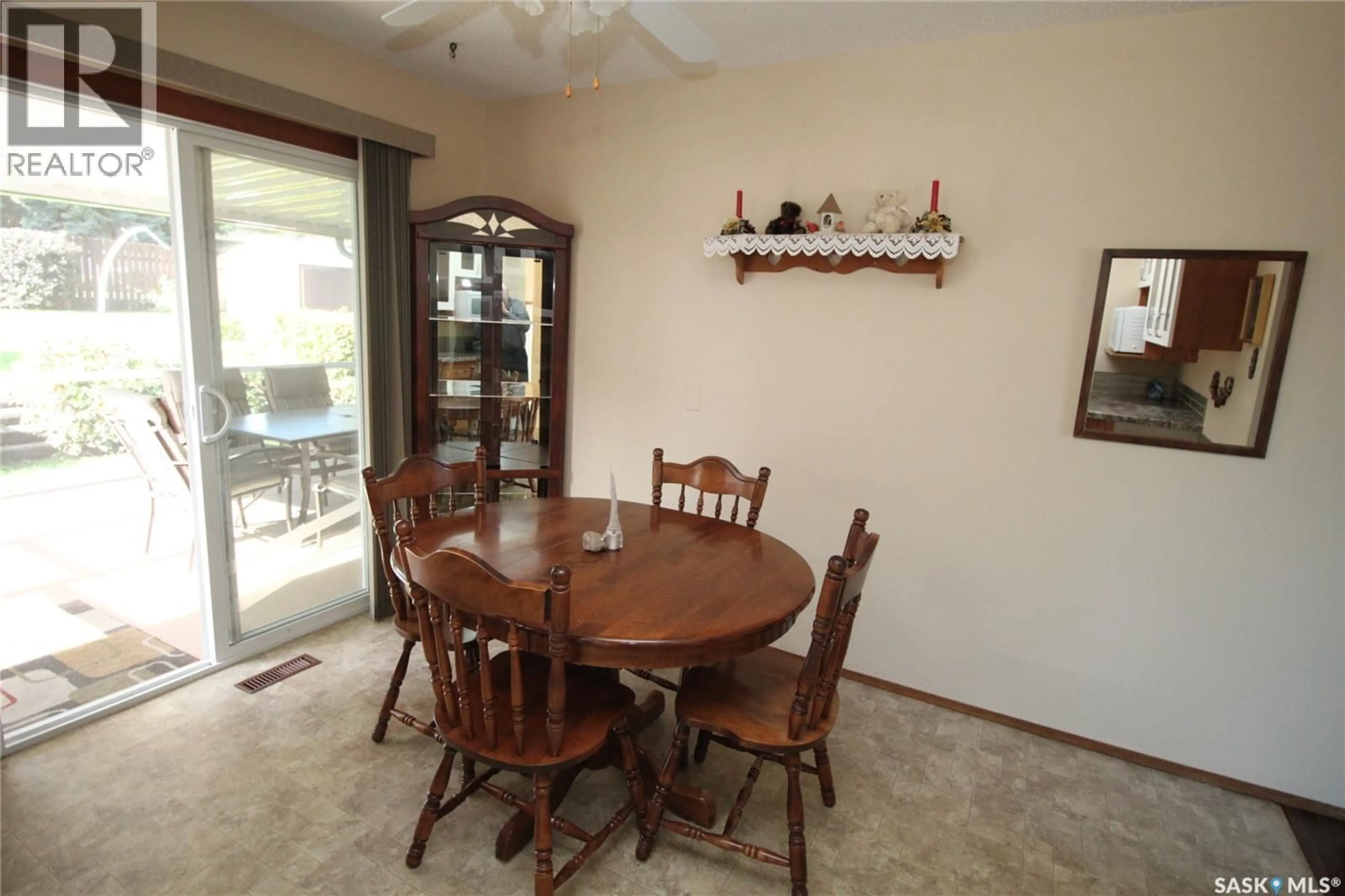 Dining room, wood/laminate floor for 15 SCHWAGER CRESCENT, Saskatoon Saskatchewan S7H5C1