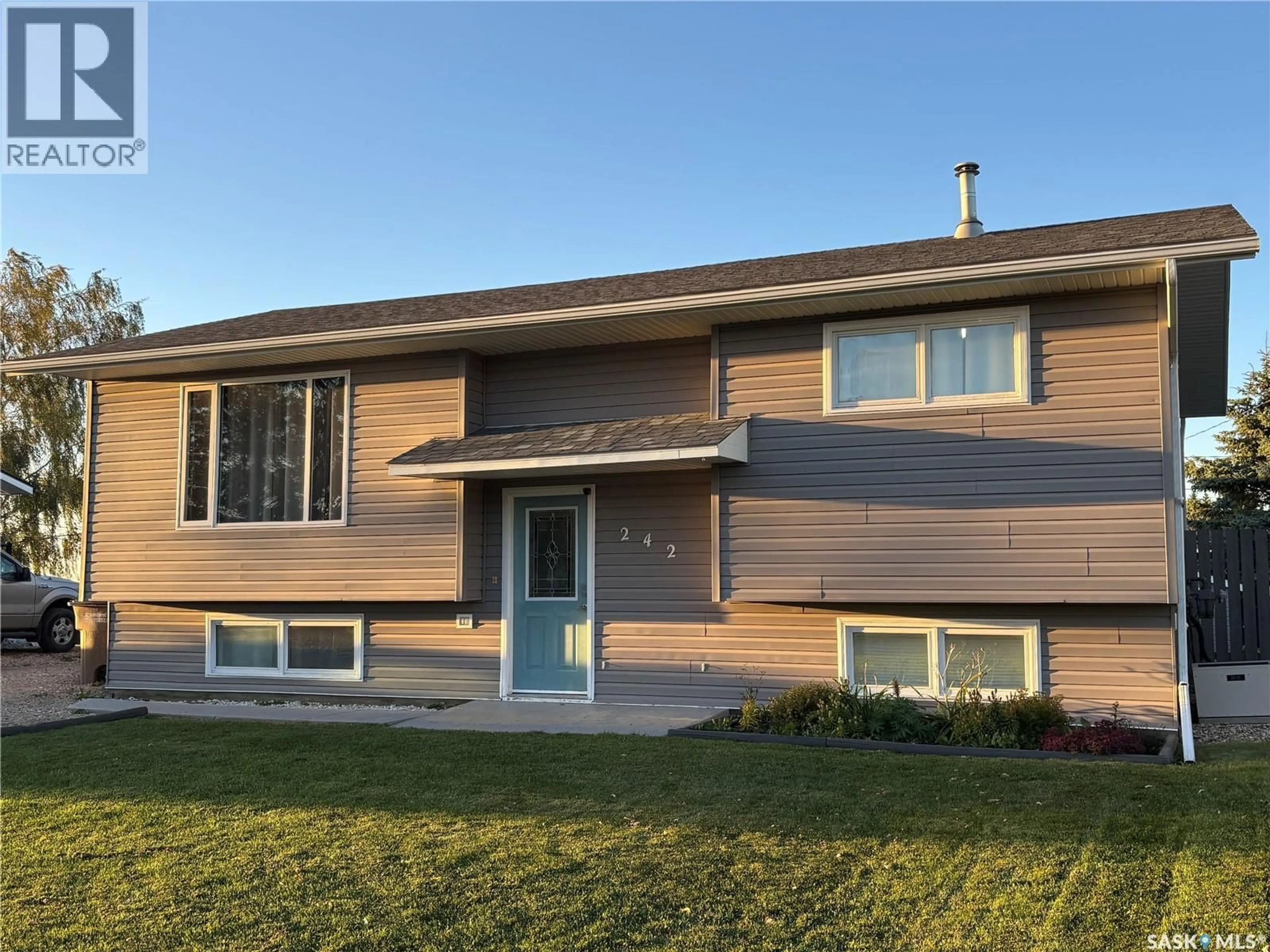 Home with vinyl exterior material, street for 242 LENDRUM STREET, Melfort Saskatchewan S0E1A0