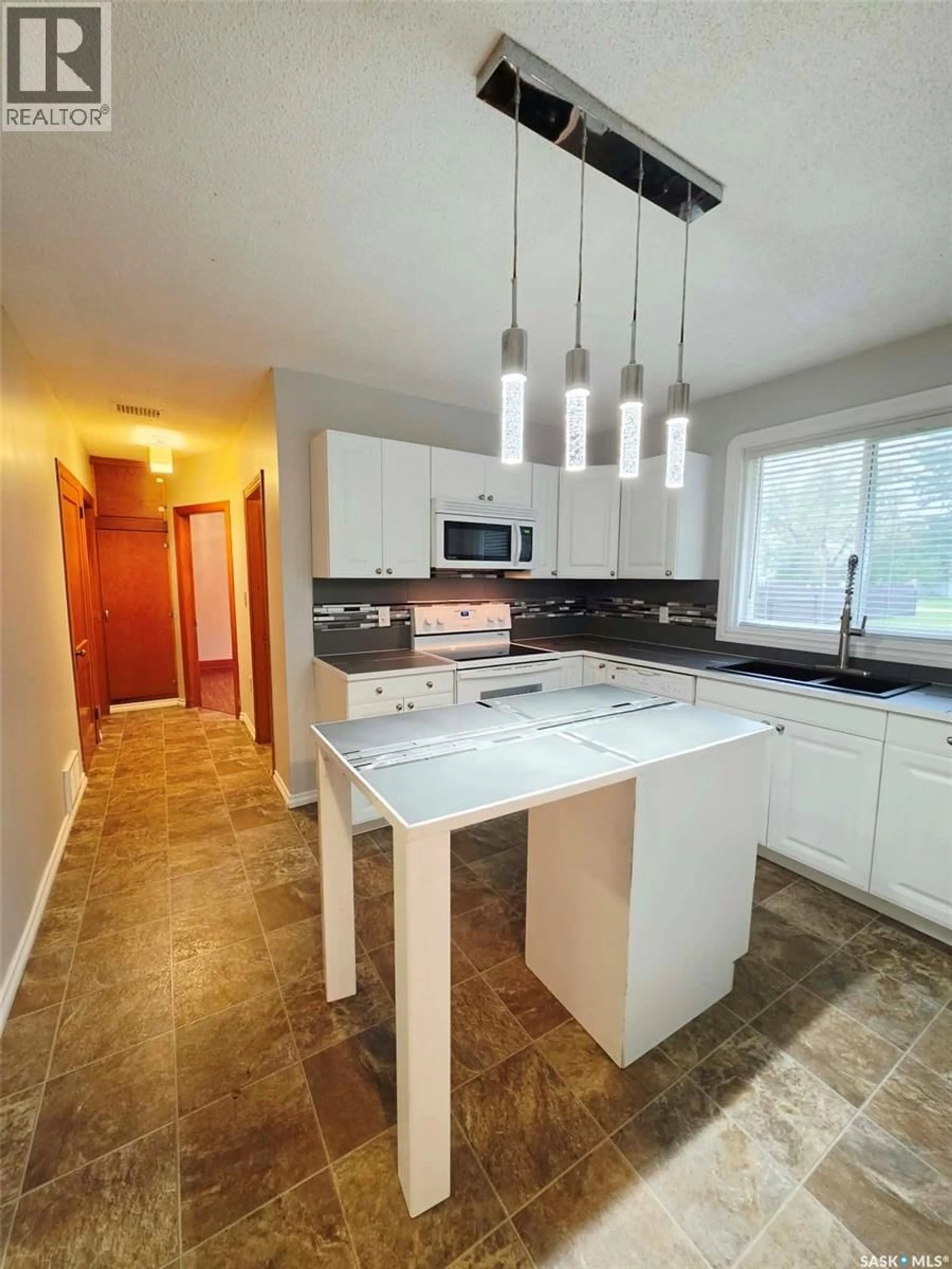 Open concept kitchen, ceramic/tile floor for 310 PARKS STREET, Whitewood Saskatchewan S0G5C0