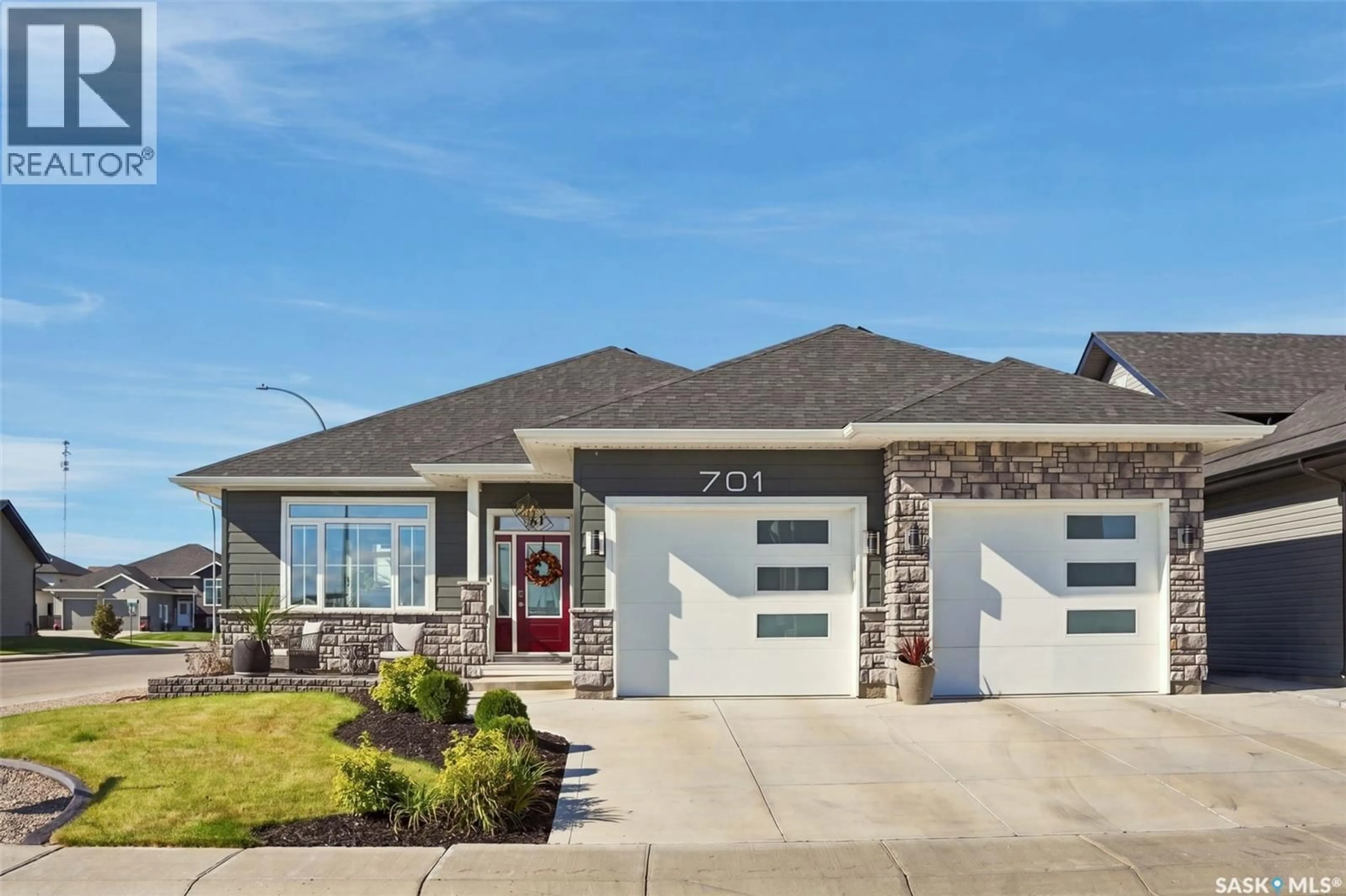 Home with vinyl exterior material, street for 701 CASPER CRESCENT, Warman Saskatchewan S0K4S4