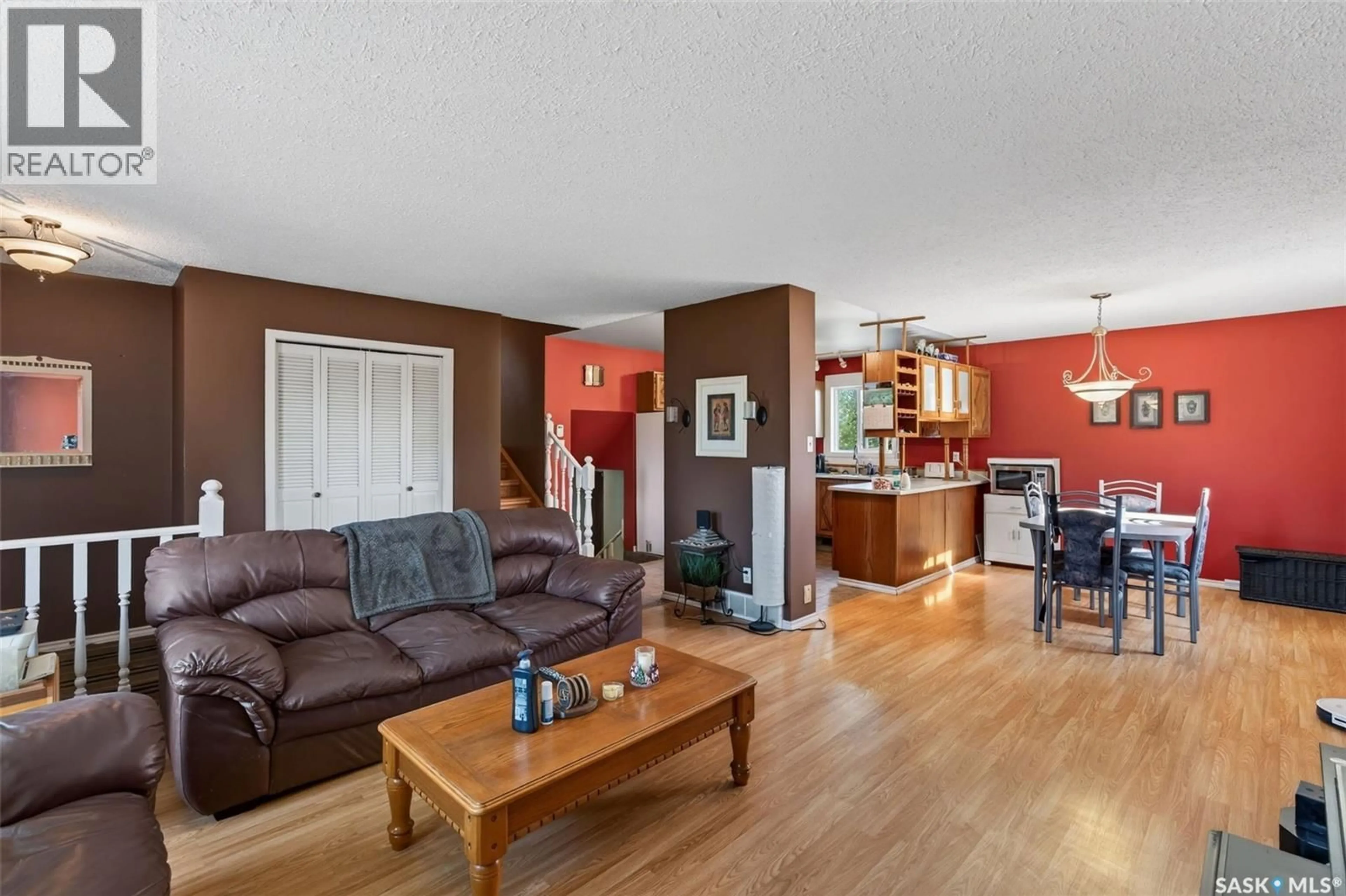 Living room with furniture, wood/laminate floor for 3458 EAGLE CRESCENT, Prince Albert Saskatchewan S6V7W9