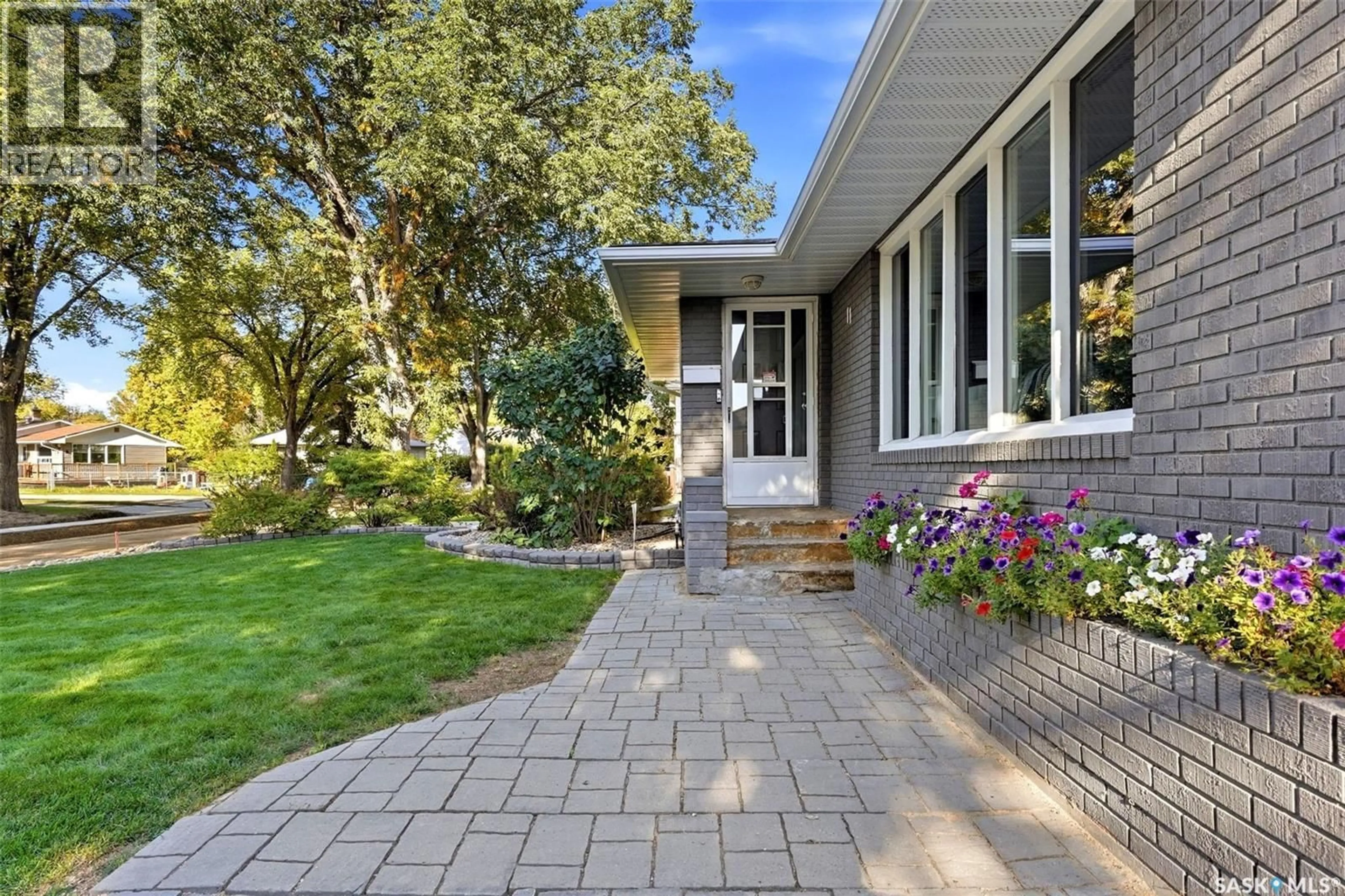 Home with brick exterior material, street for 11 DOLPHIN BAY, Regina Saskatchewan S4S3J7