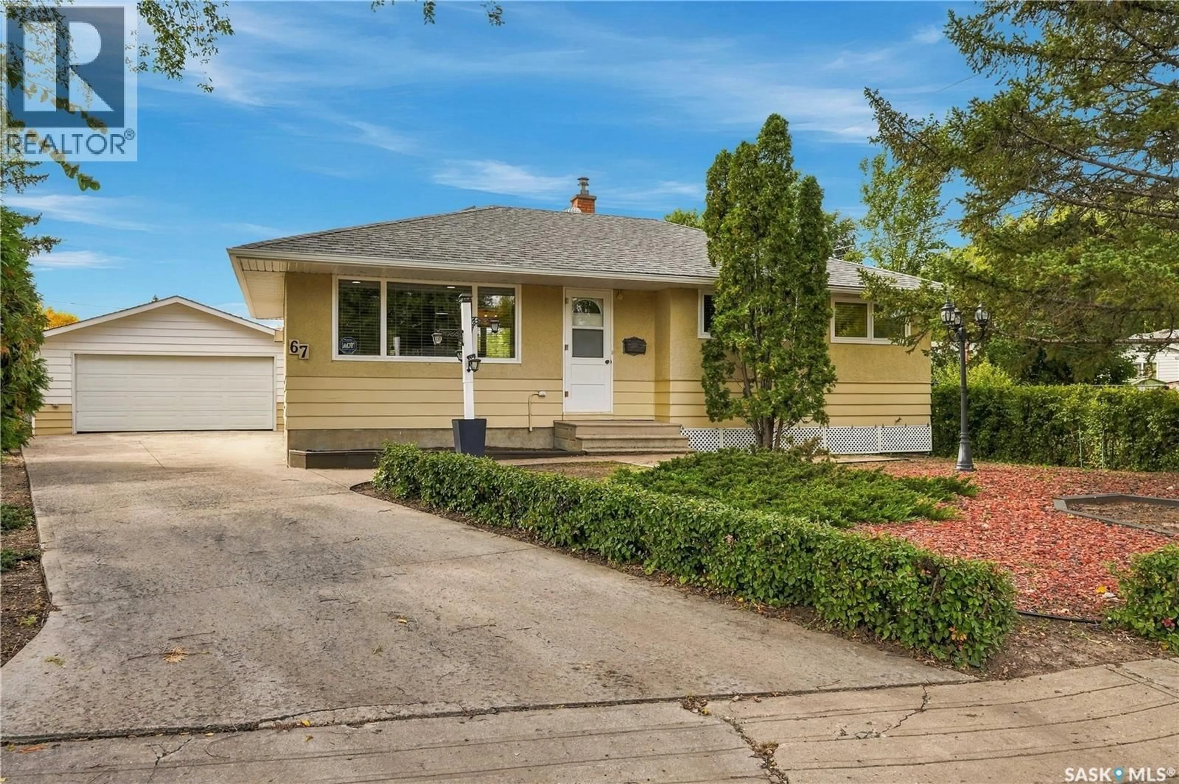 Home with vinyl exterior material, street for 67 LAIRD CRESCENT, Regina Saskatchewan S4R4N7