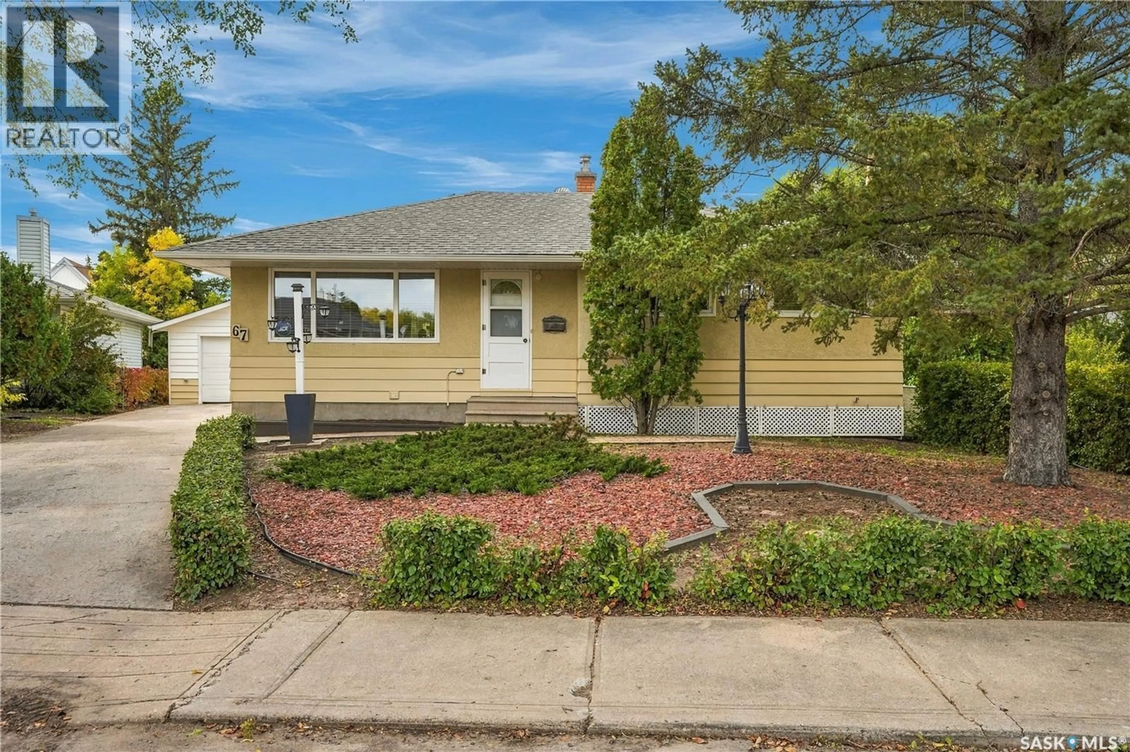 Home with vinyl exterior material, street for 67 LAIRD CRESCENT, Regina Saskatchewan S4R4N7