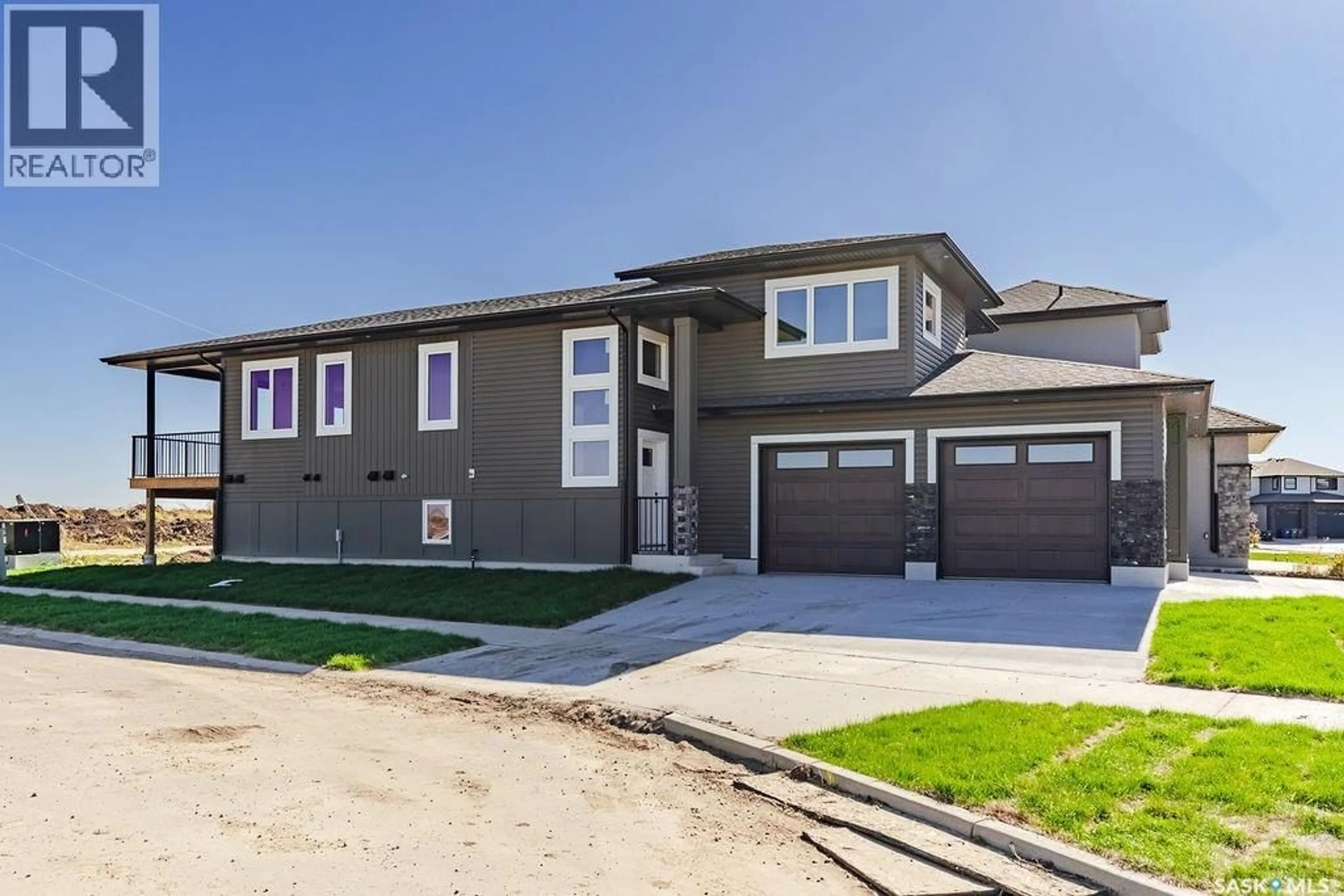 Home with vinyl exterior material, street for 492 WOOLF BEND, Saskatoon Saskatchewan S7W1E4