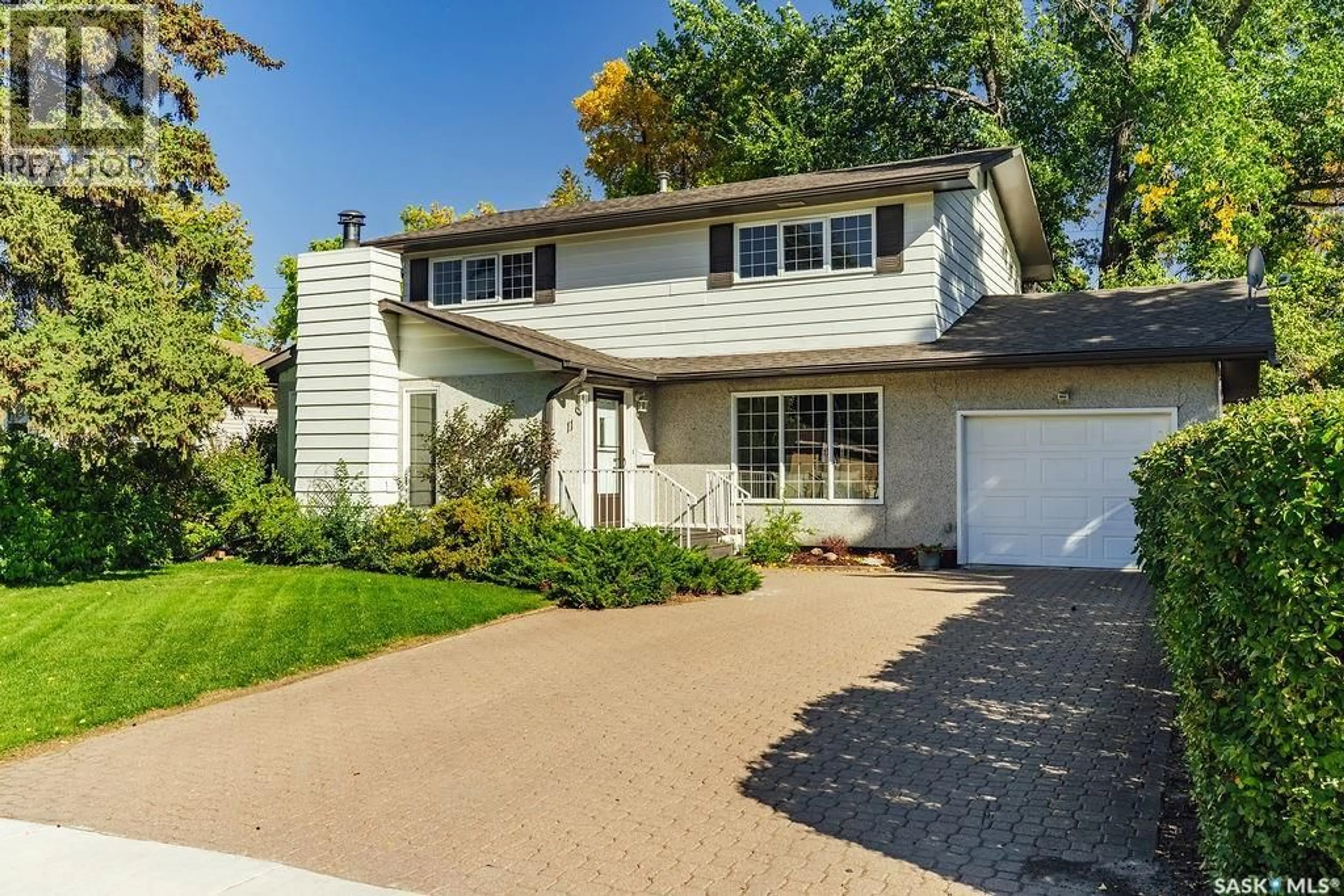 Home with vinyl exterior material, street for 11 MOXON CRESCENT, Saskatoon Saskatchewan S7H3B8