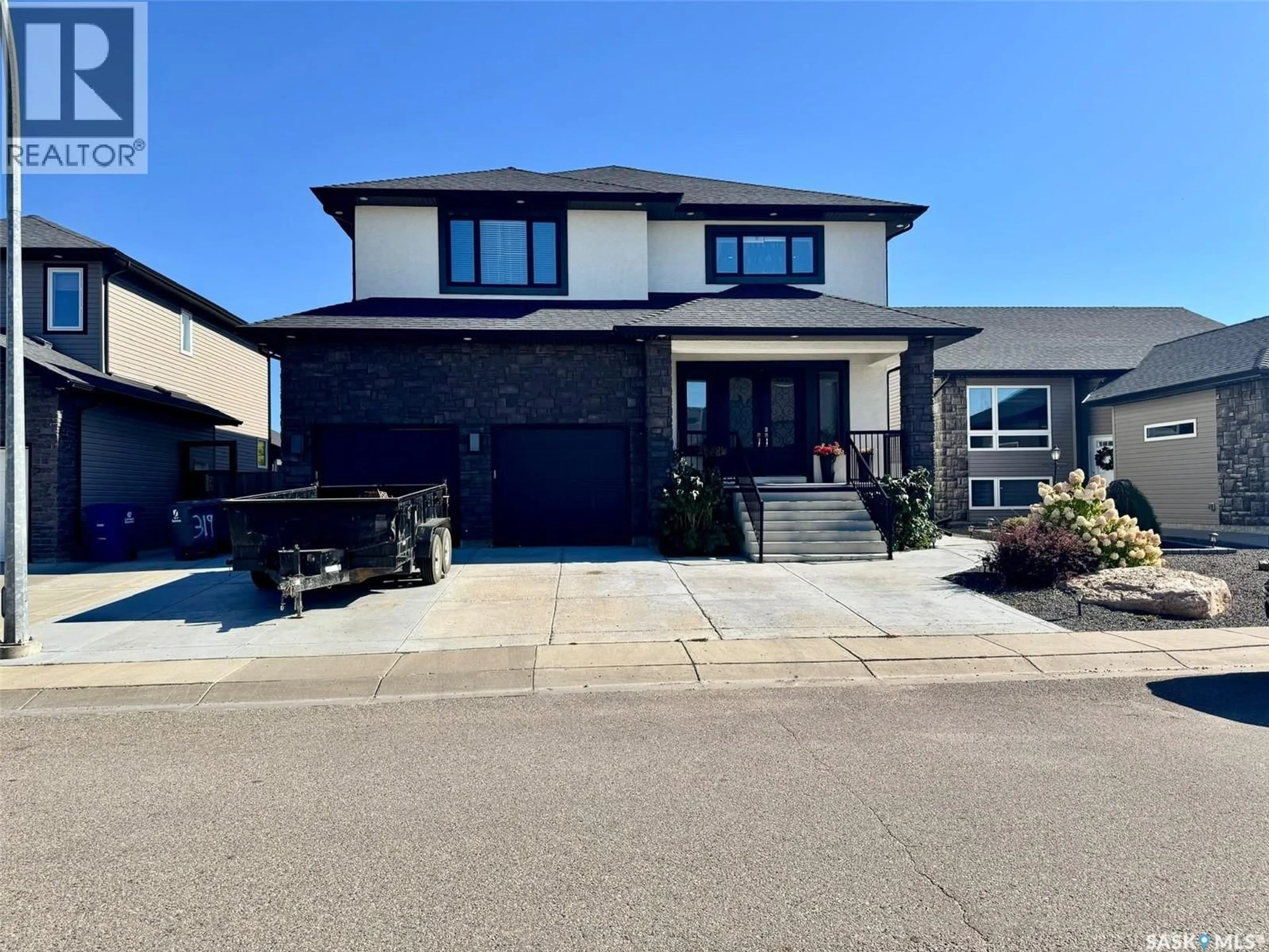 Home with vinyl exterior material, street for 319 ROY CRESCENT, Saskatoon Saskatchewan S7W0L1