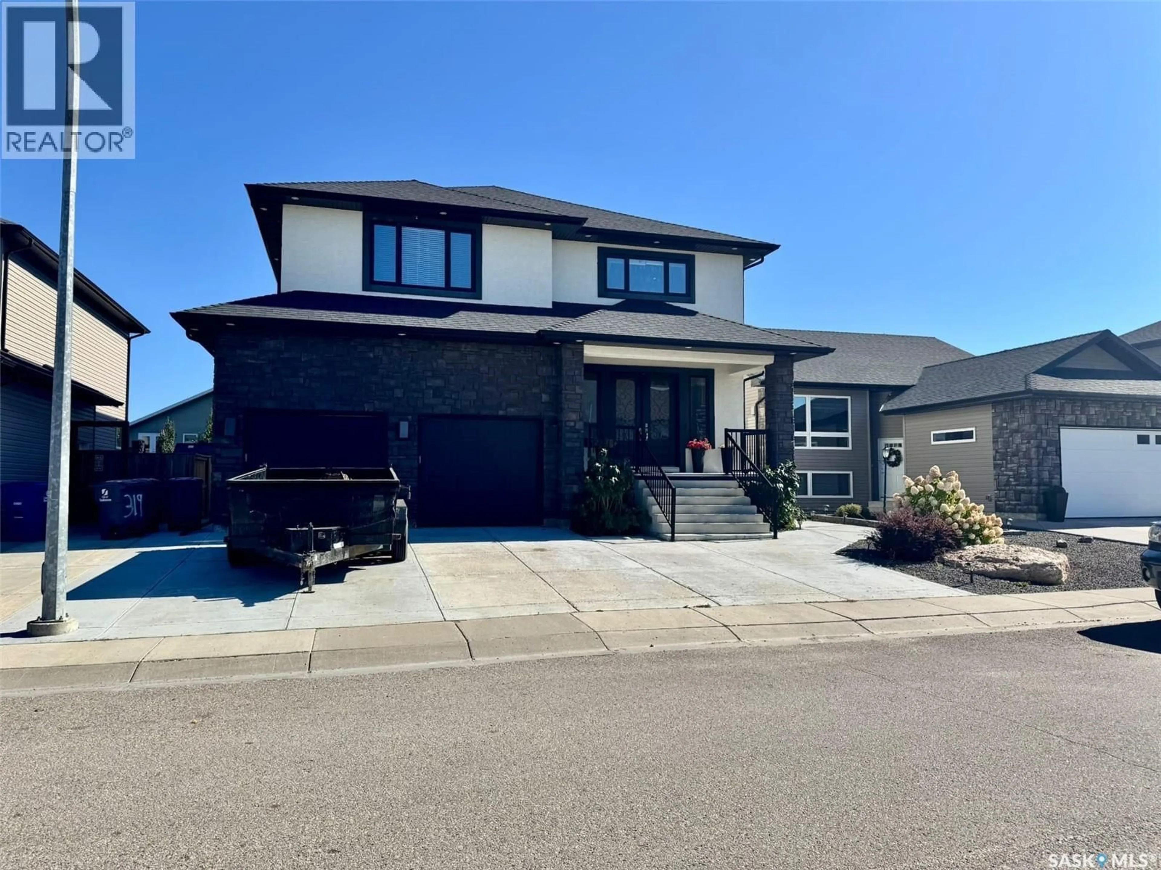 Home with vinyl exterior material, street for 319 ROY CRESCENT, Saskatoon Saskatchewan S7W0L1