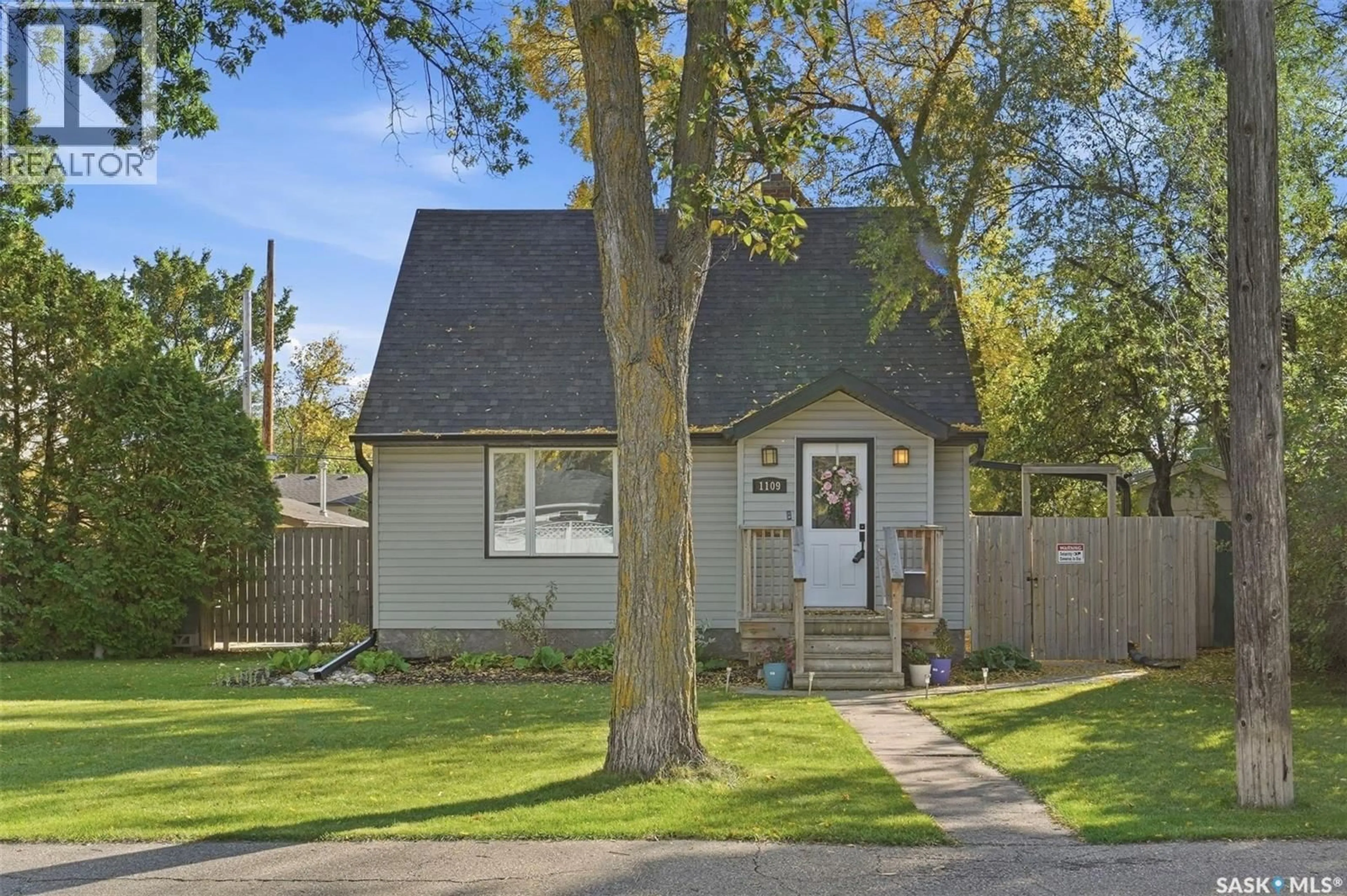 Home with vinyl exterior material, street for 1109 OXFORD STREET, Saskatoon Saskatchewan S7K0Y5