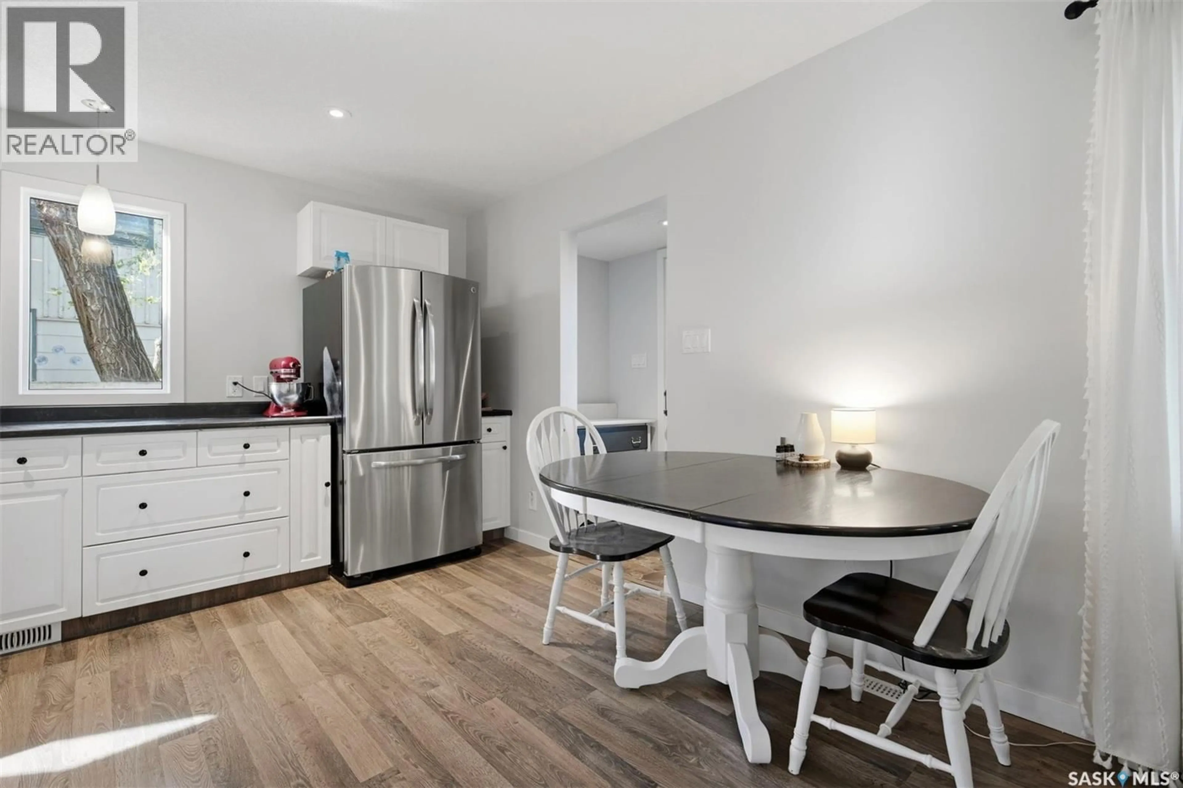 Open concept kitchen, wood/laminate floor for 1109 OXFORD STREET, Saskatoon Saskatchewan S7K0Y5