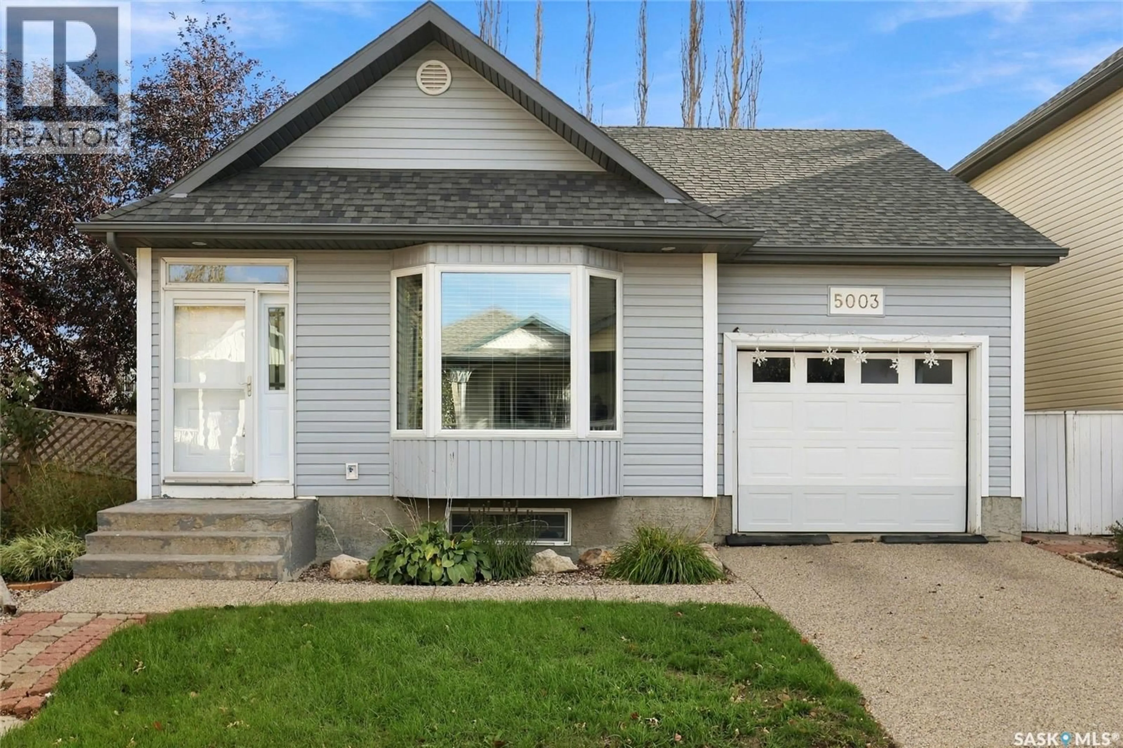 Home with vinyl exterior material, street for 5003 PRIMROSE LANE, Regina Saskatchewan S4X4M7