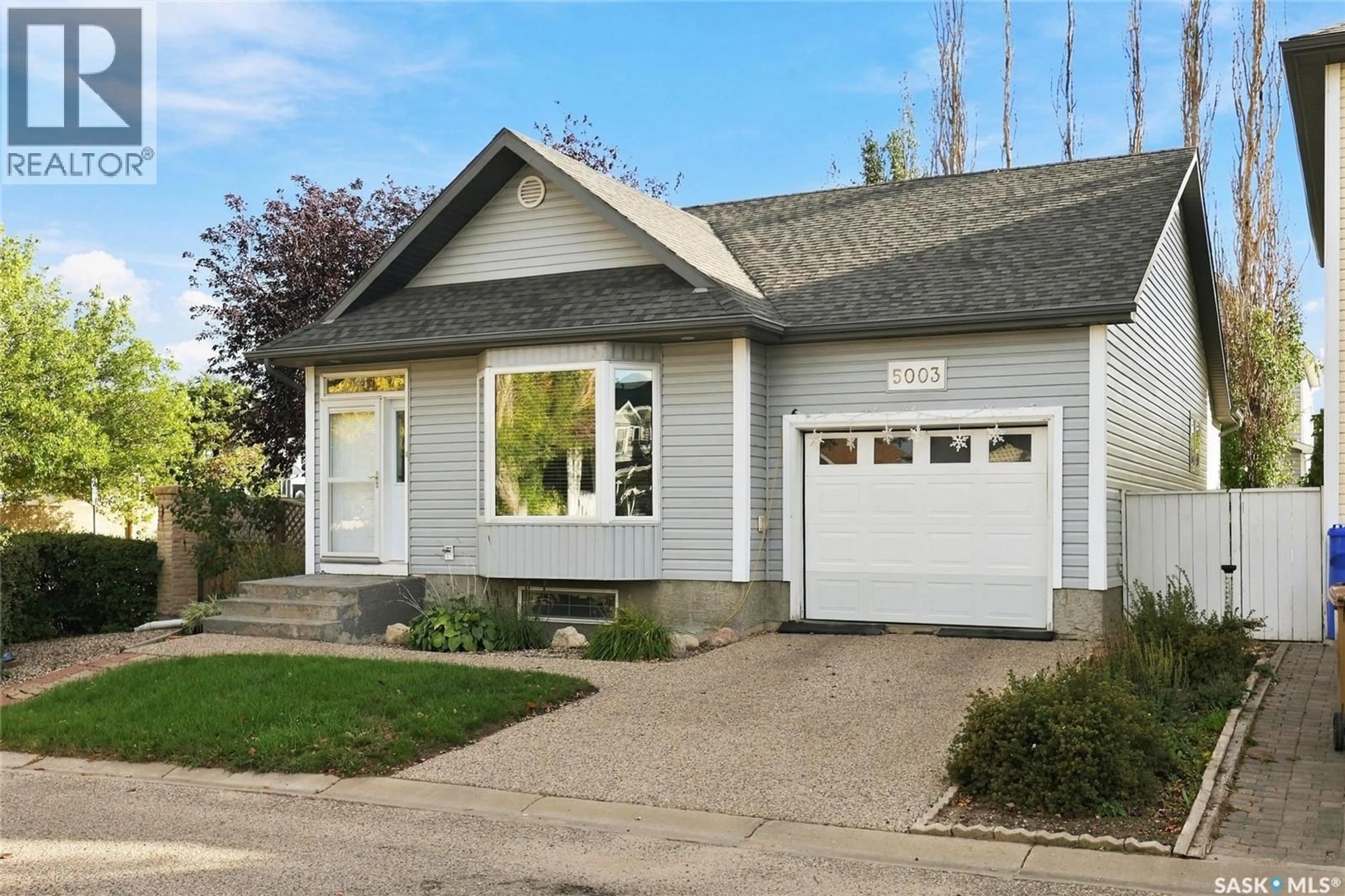 Home with vinyl exterior material, street for 5003 PRIMROSE LANE, Regina Saskatchewan S4X4M7