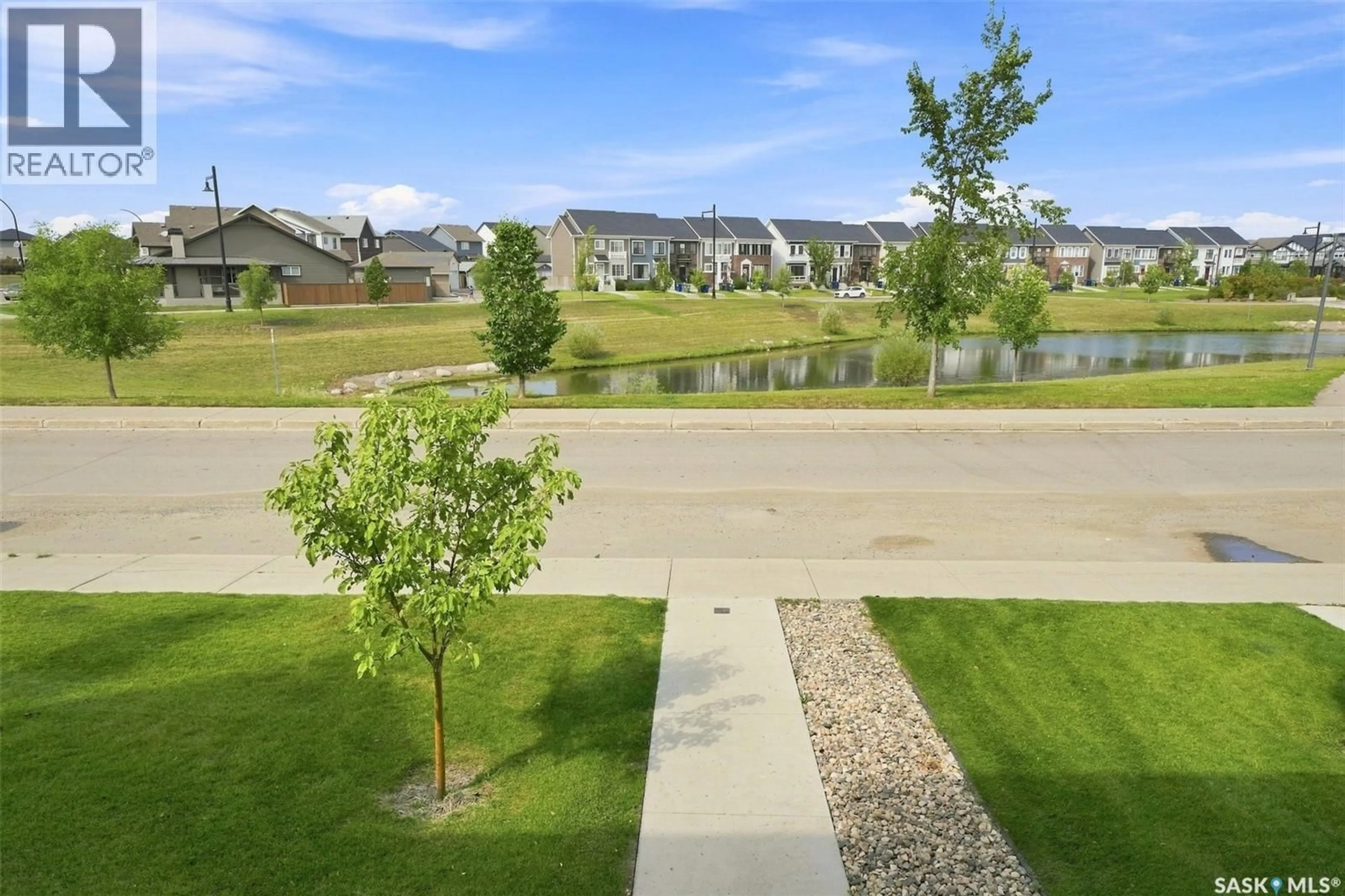 A pic from outside/outdoor area/front of a property/back of a property/a pic from drone, water/lake/river/ocean view for 3043 BRIGHTON COMMON, Saskatoon Saskatchewan S7V0Z5