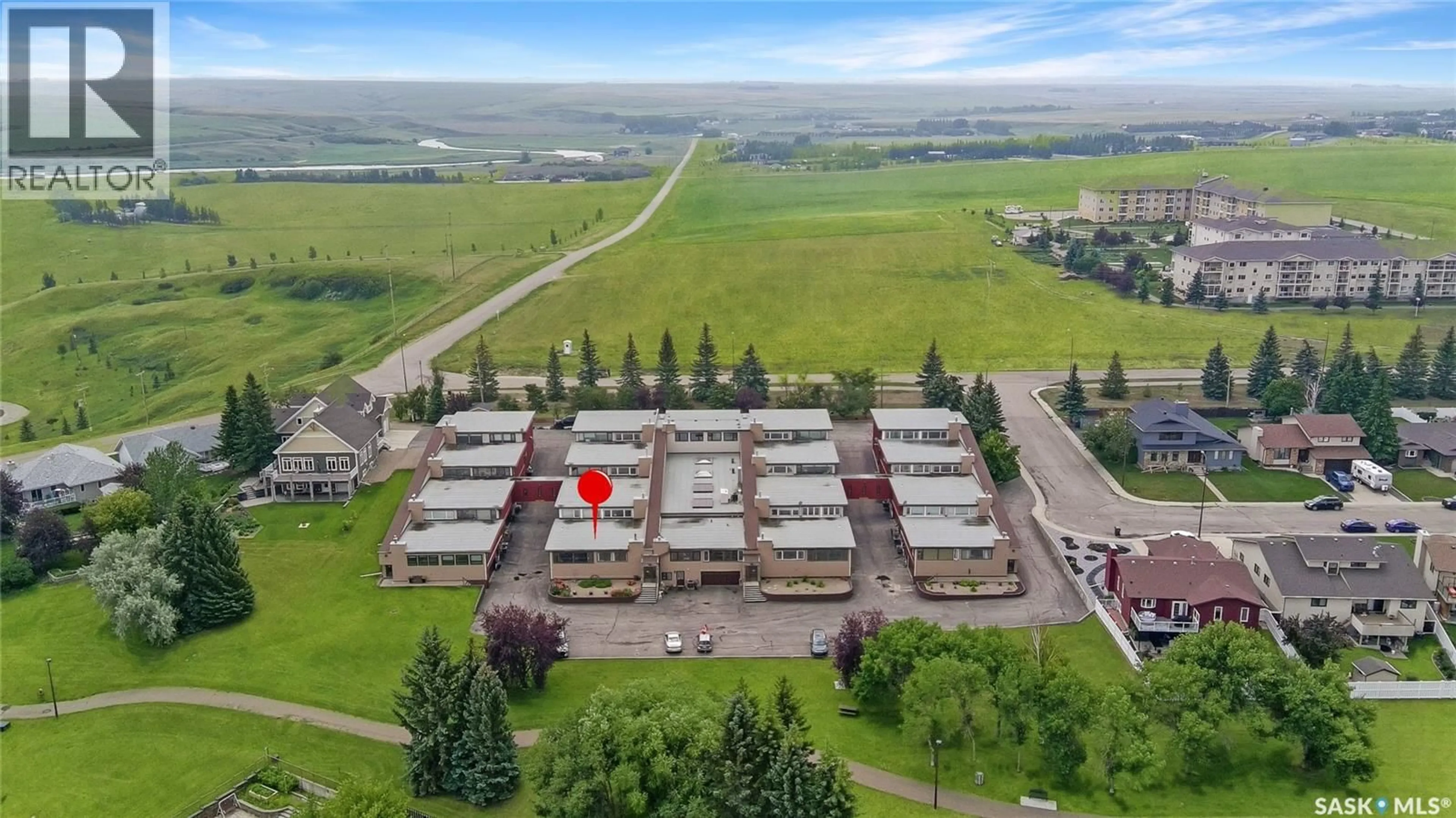 A pic from outside/outdoor area/front of a property/back of a property/a pic from drone, building for 8 275 ALPINE CRESCENT, Swift Current Saskatchewan S9H4T5