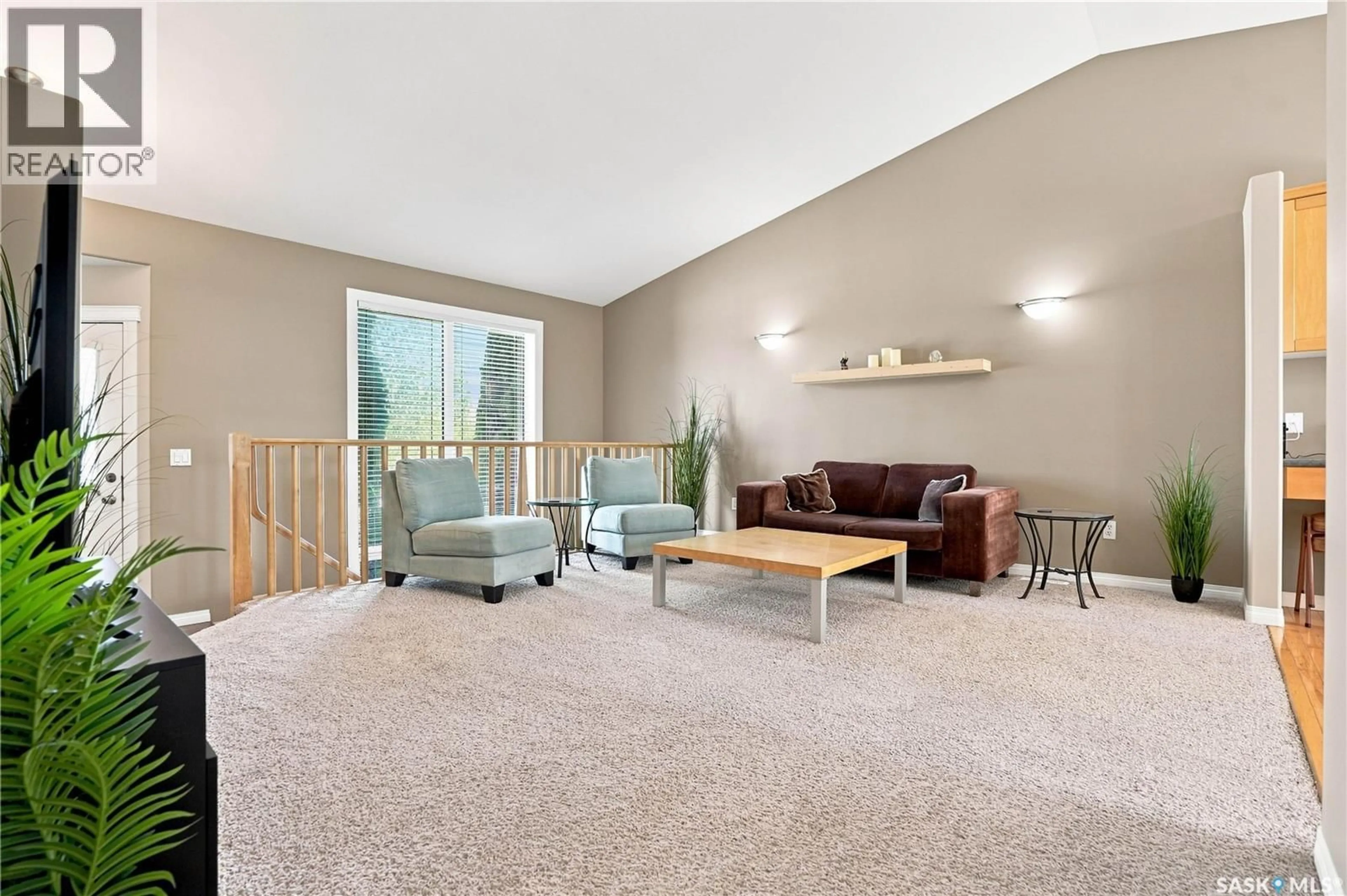 Living room with furniture, carpet floor for 410 BOURGONJE COURT, Saskatoon Saskatchewan S7S1L7
