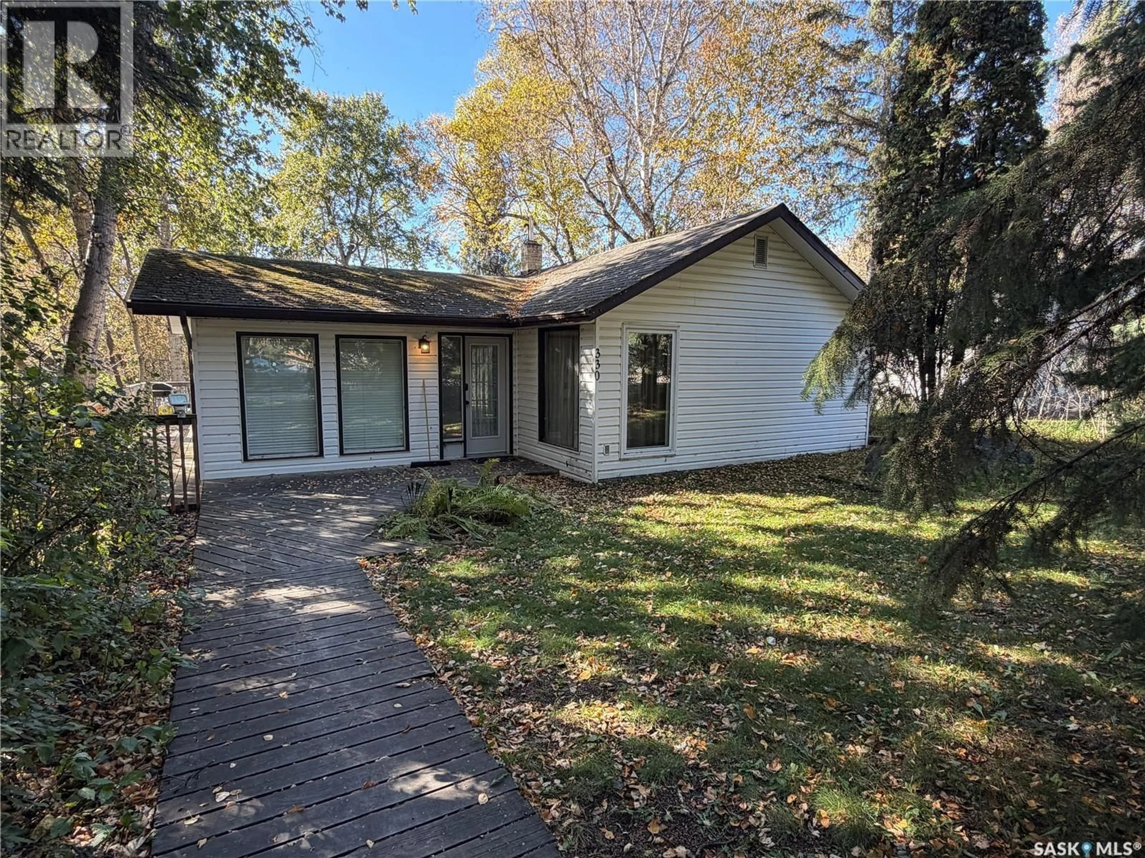 Home with vinyl exterior material, street for 330 1ST AVENUE, Big River Saskatchewan S0J0E0