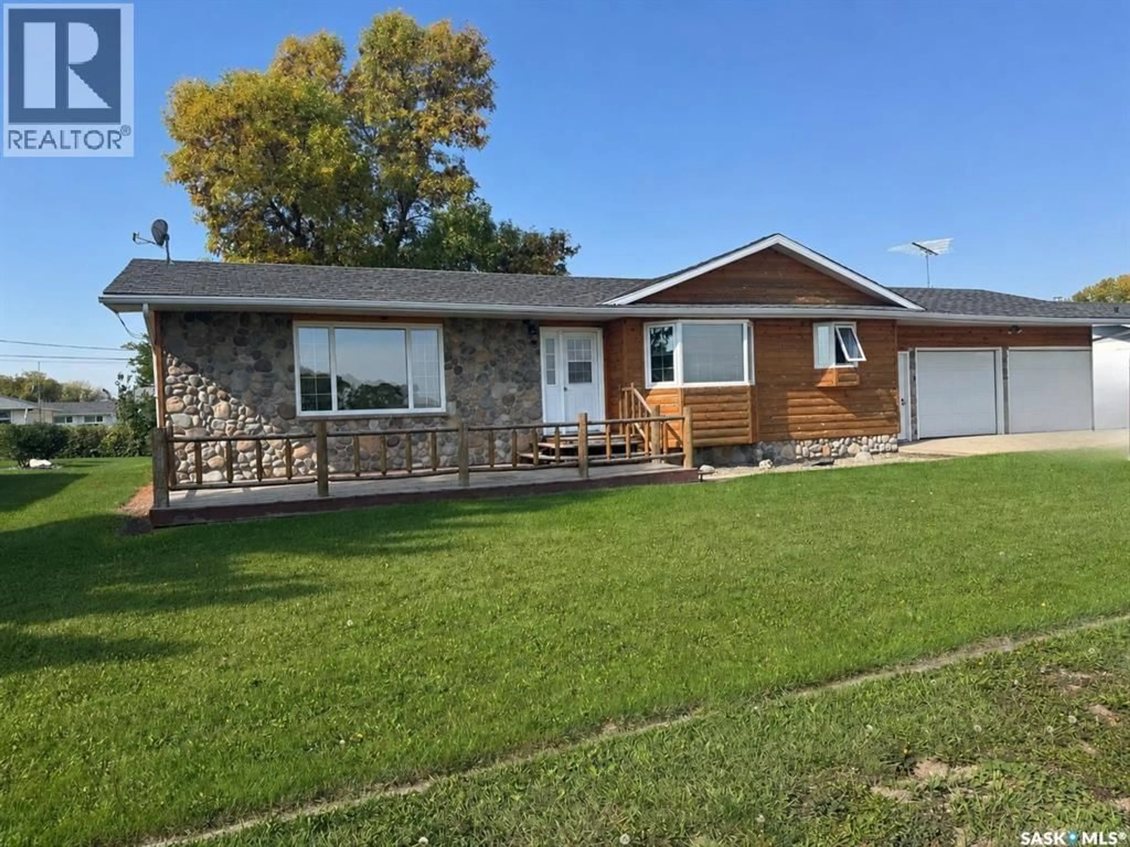 Home with vinyl exterior material, street for 203 MACDONALD STREET, Stockholm Saskatchewan S0A3Y0