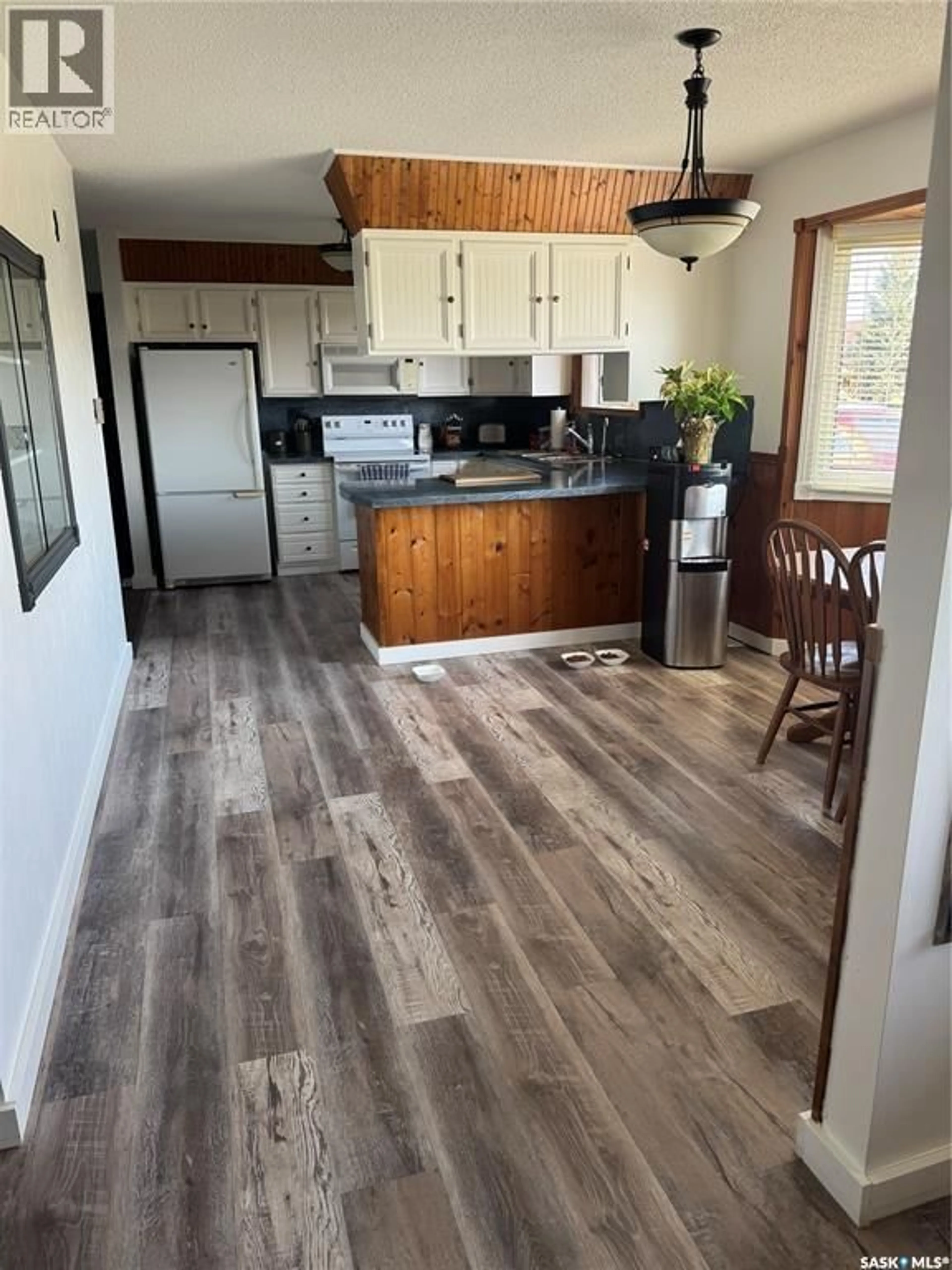 Open concept kitchen, wood/laminate floor for 203 MACDONALD STREET, Stockholm Saskatchewan S0A3Y0