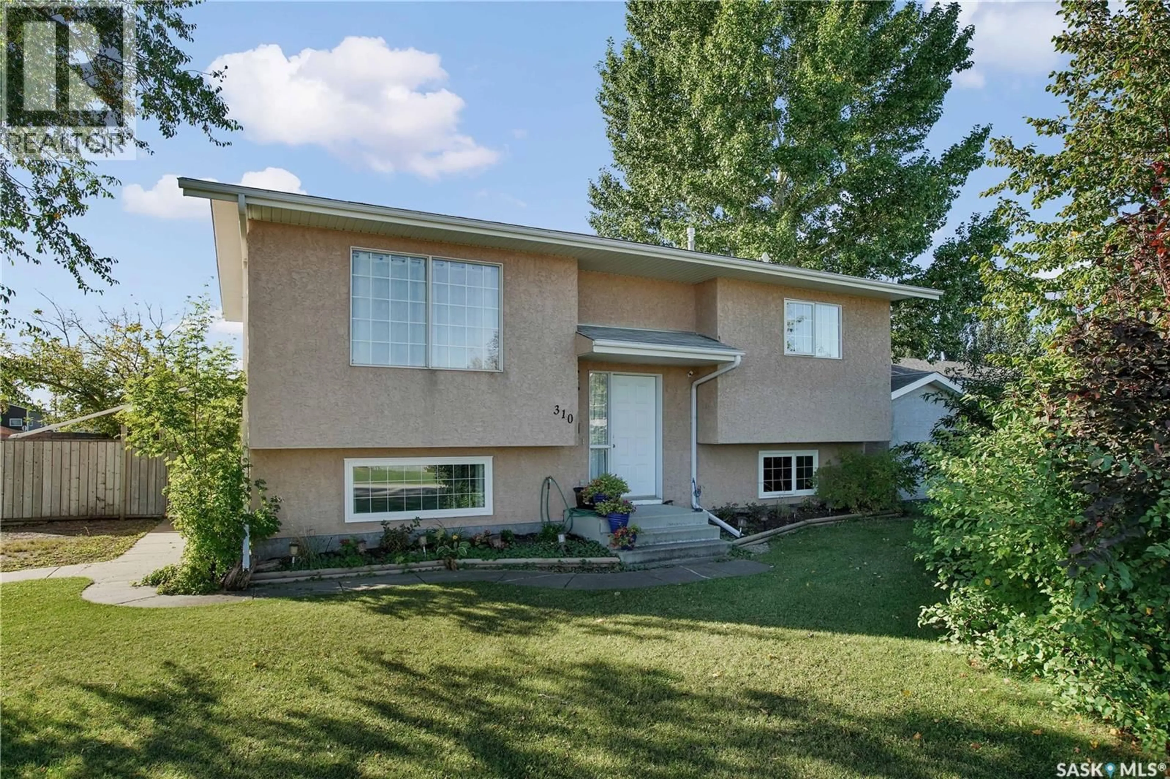 Home with vinyl exterior material, street for 310 4TH STREET, Dundurn Saskatchewan S0K1K0