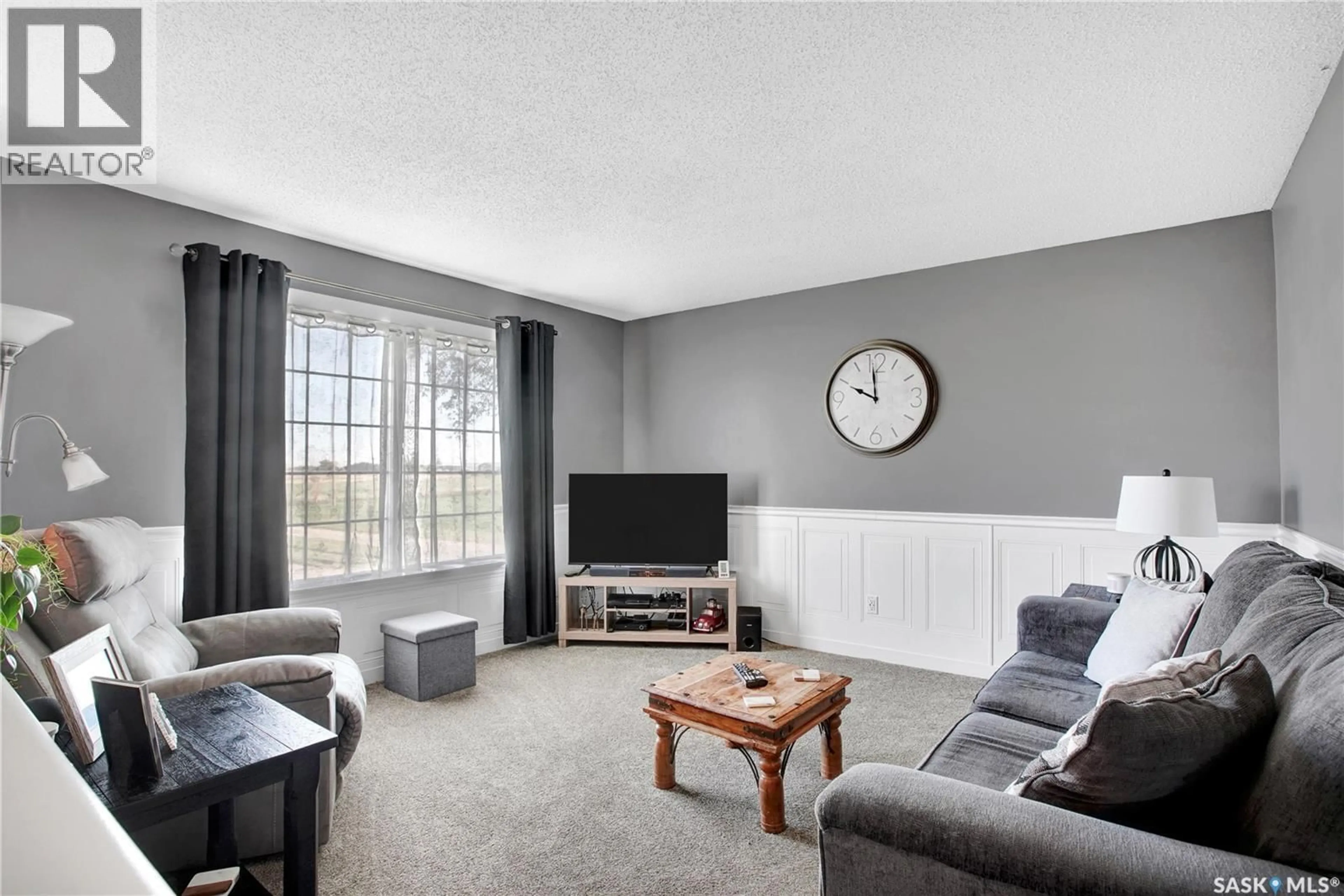 Living room with furniture, unknown for 310 4TH STREET, Dundurn Saskatchewan S0K1K0