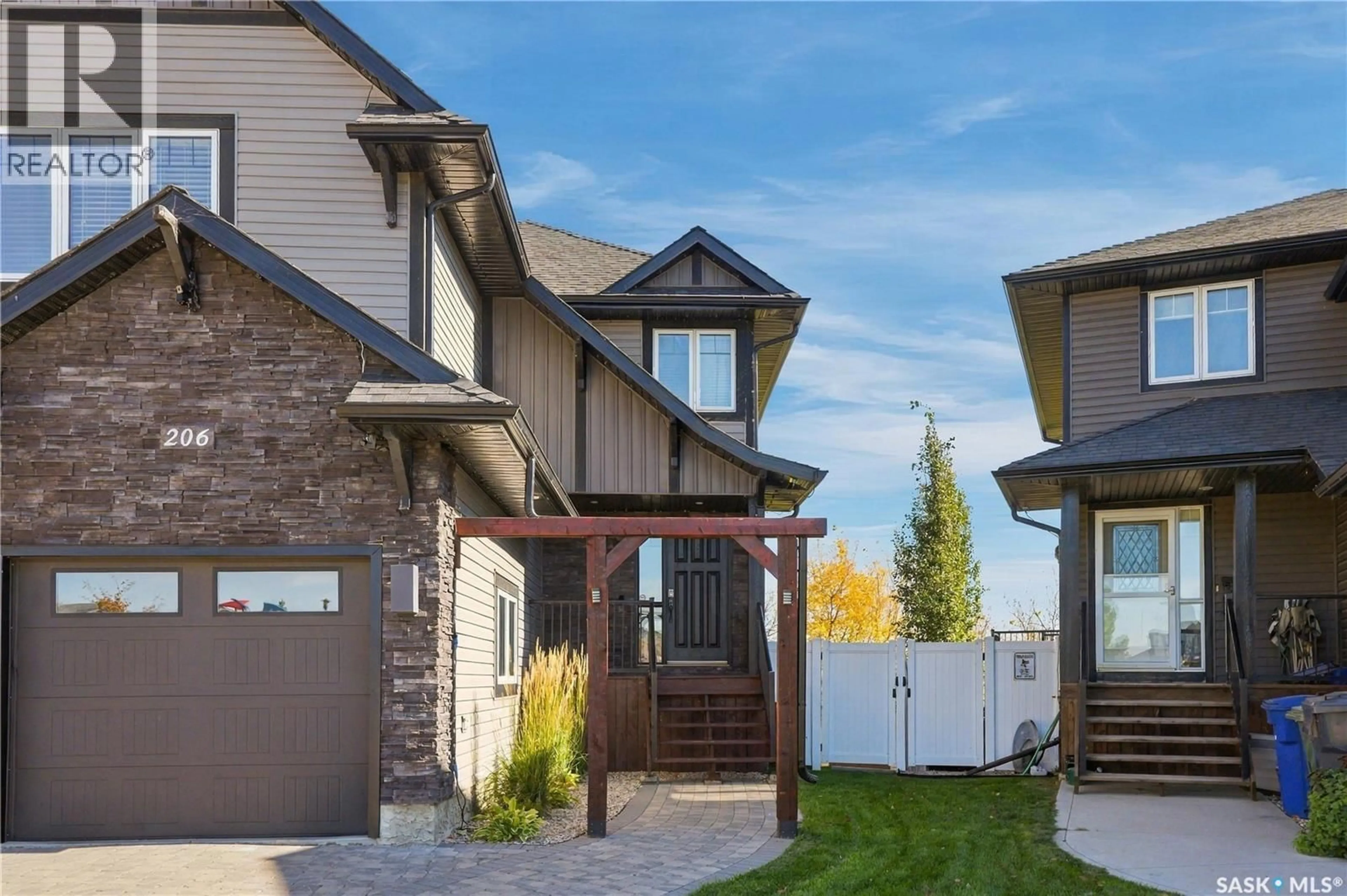 Home with brick exterior material, street for 206 PARKVIEW COVE, Osler Saskatchewan S0K3A0