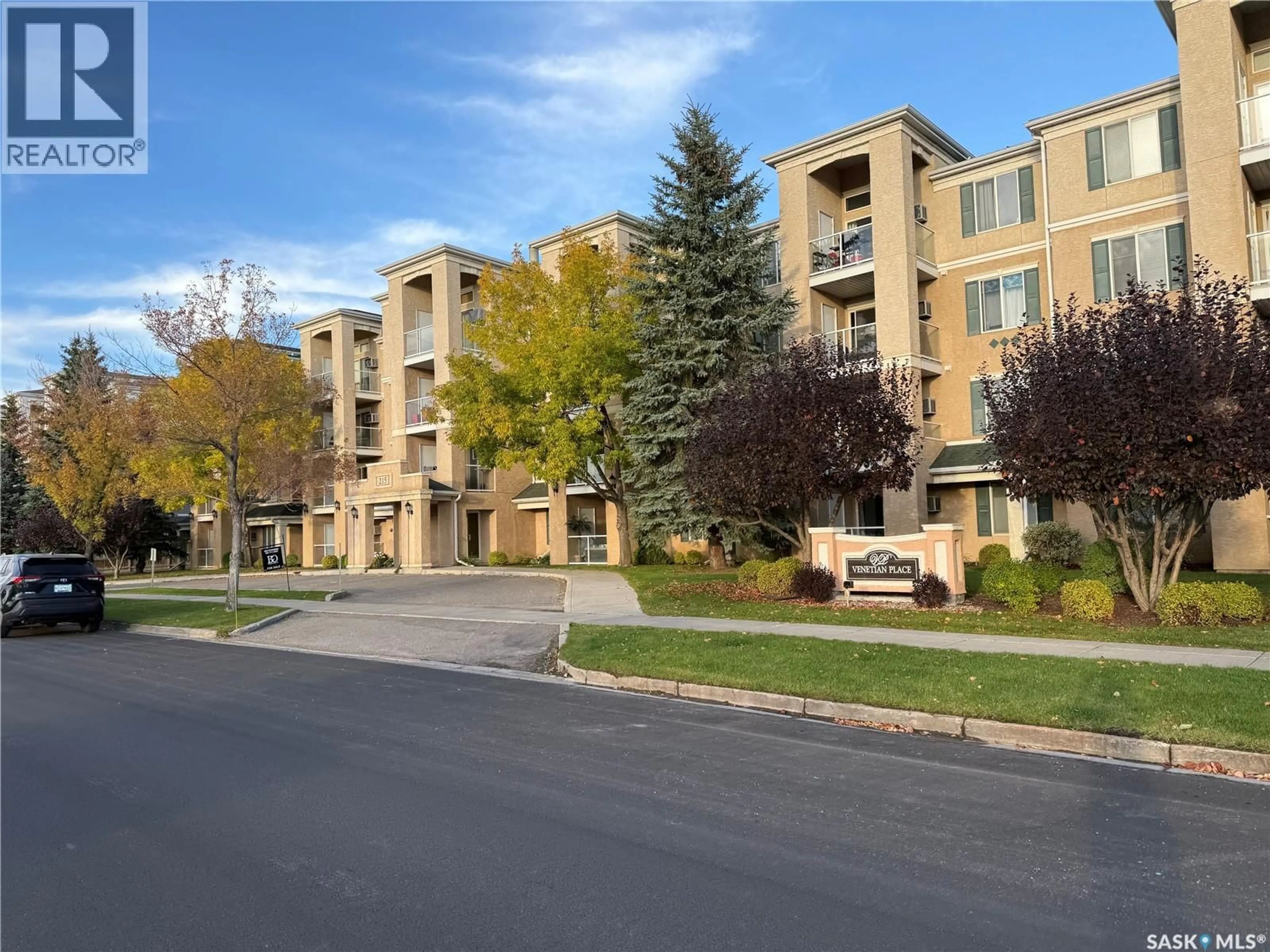 A pic from outside/outdoor area/front of a property/back of a property/a pic from drone, street for 311 215 LOWE ROAD, Saskatoon Saskatchewan S7S1N1