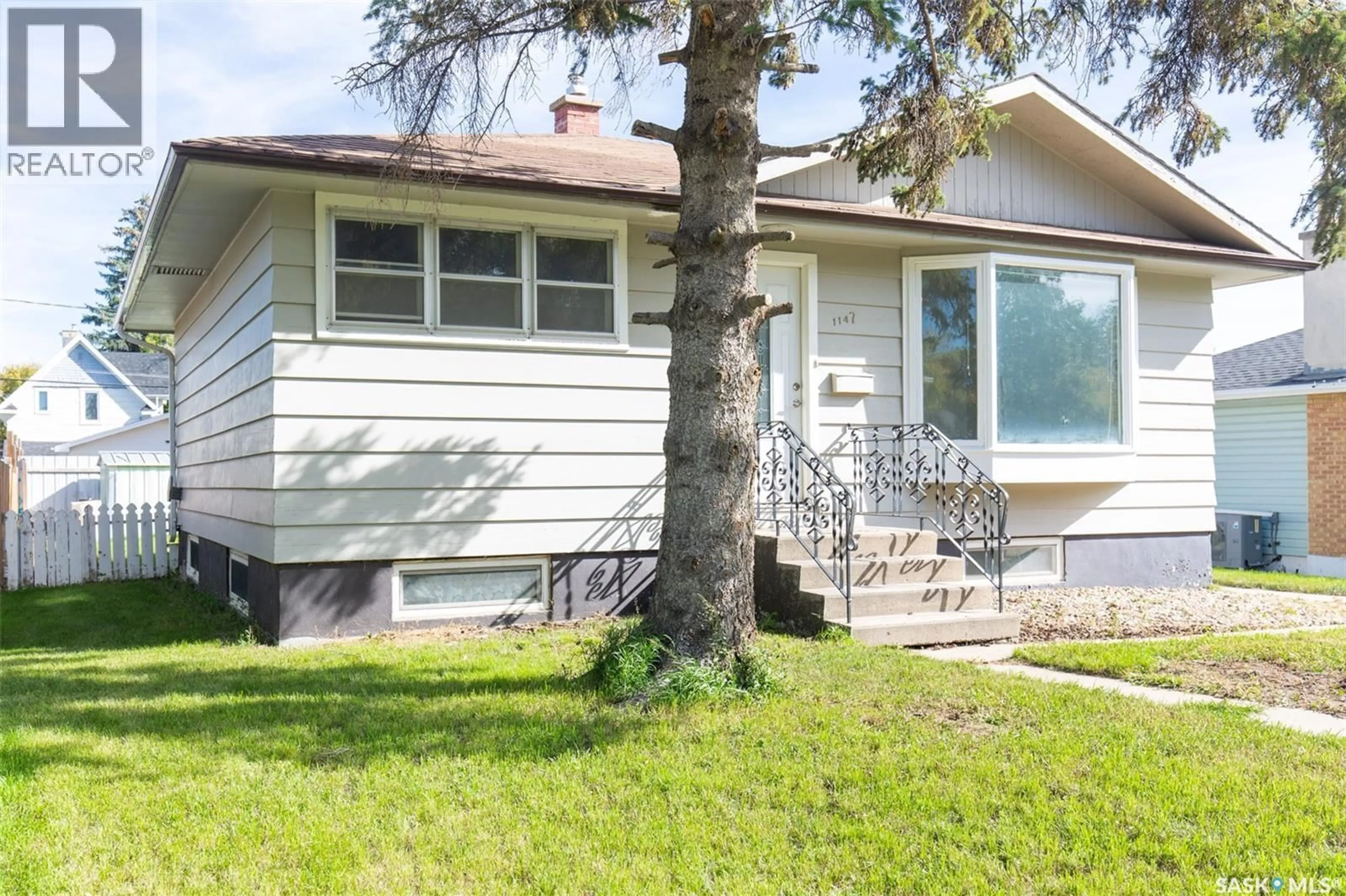 Home with vinyl exterior material, street for 1147 MAIN STREET, Moose Jaw Saskatchewan S6H0X3