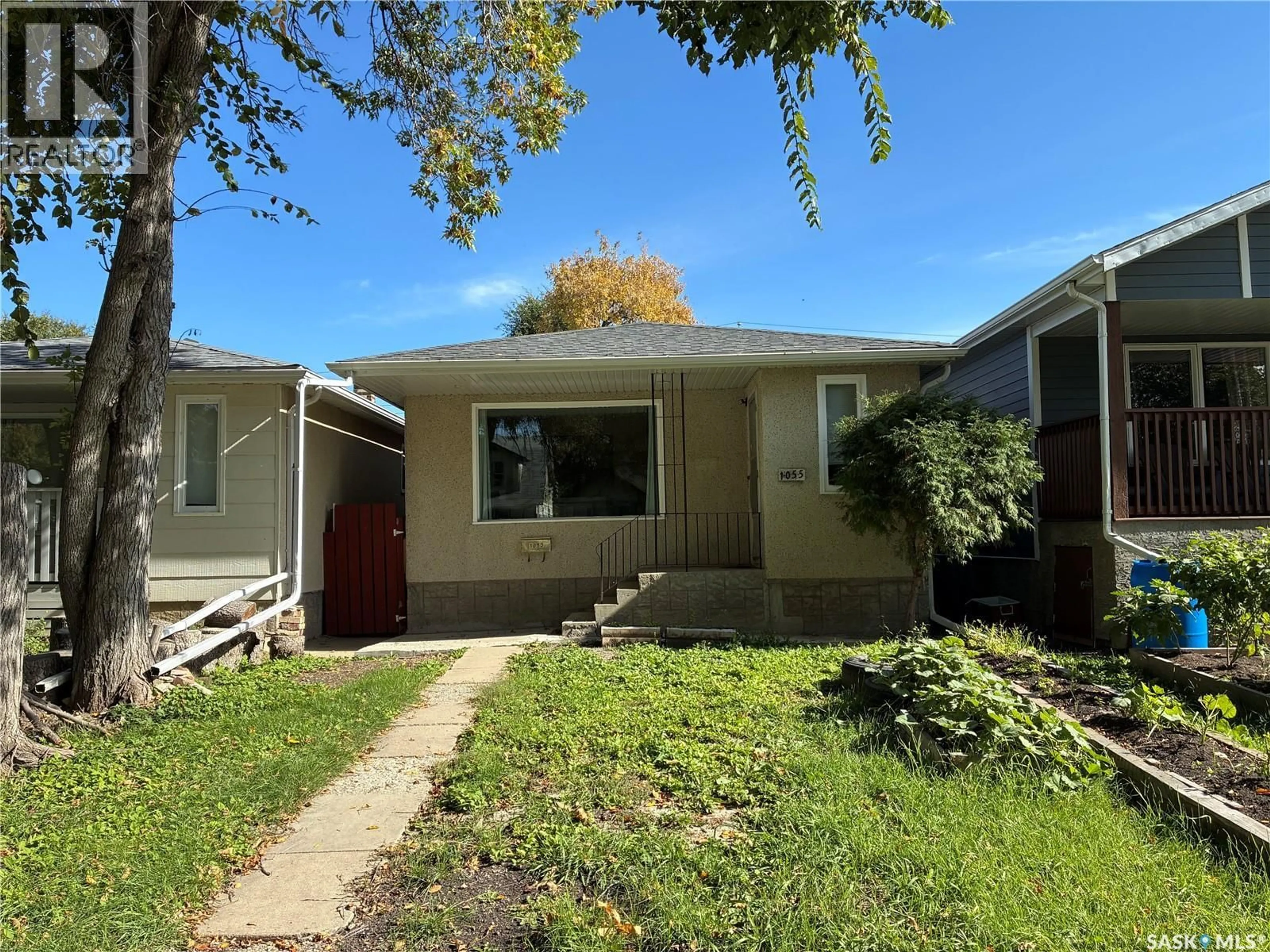 Home with vinyl exterior material, street for 1055 CAMERON STREET, Regina Saskatchewan S4V1A8