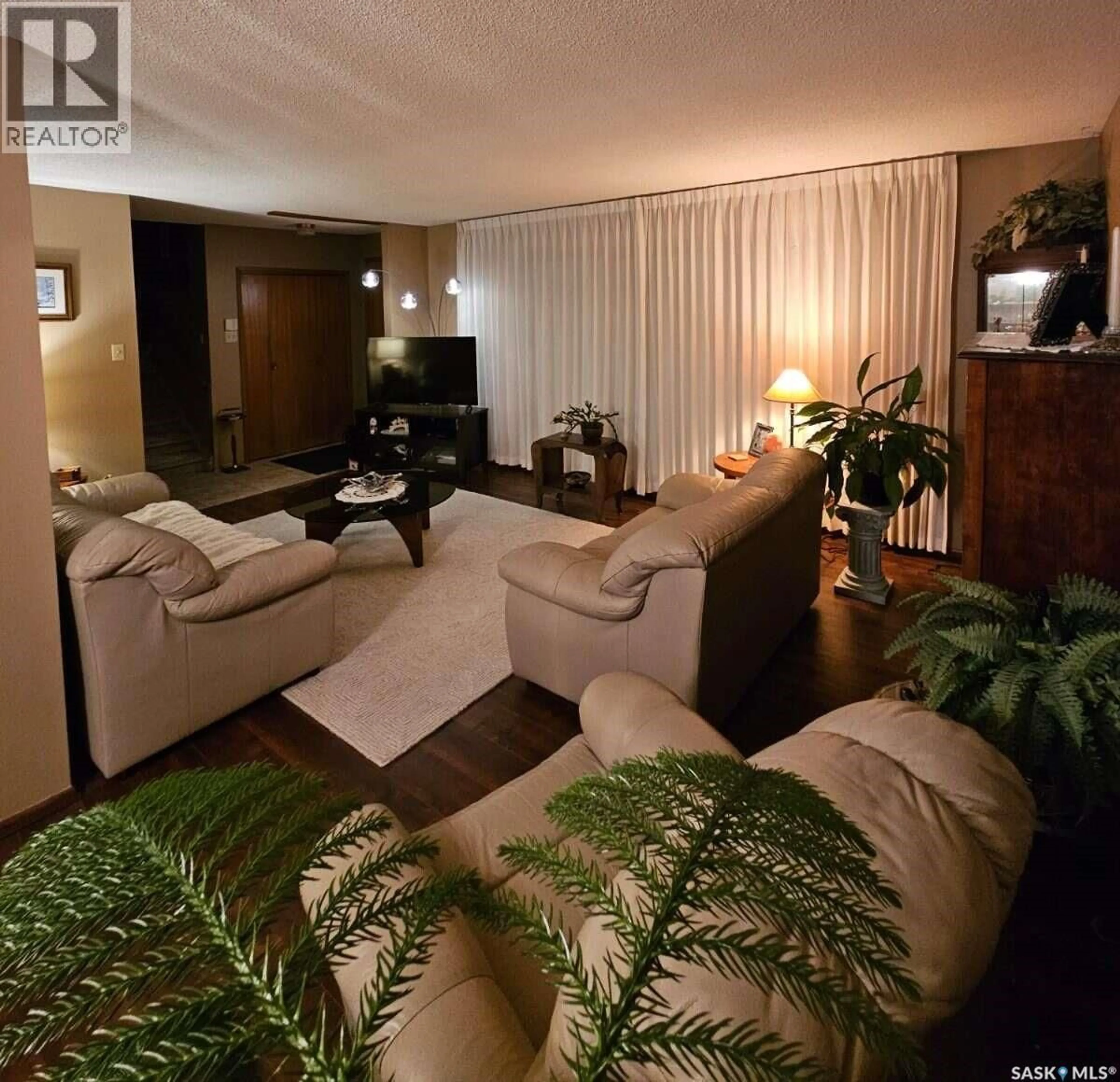 Living room with furniture, wood/laminate floor for 549 LAURIER DRIVE, Prince Albert Saskatchewan S6V5M4
