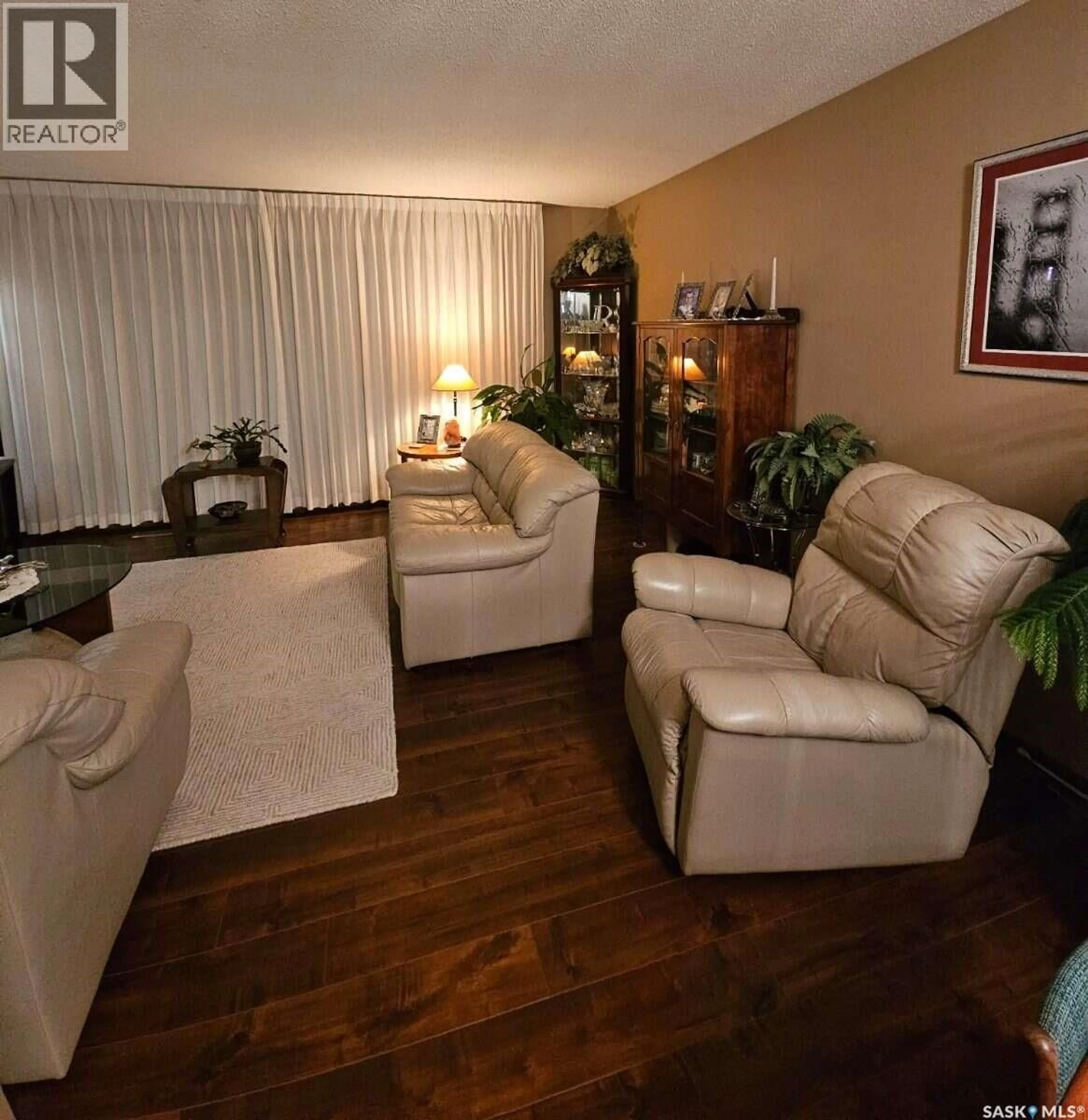 Living room with furniture, wood/laminate floor for 549 LAURIER DRIVE, Prince Albert Saskatchewan S6V5M4