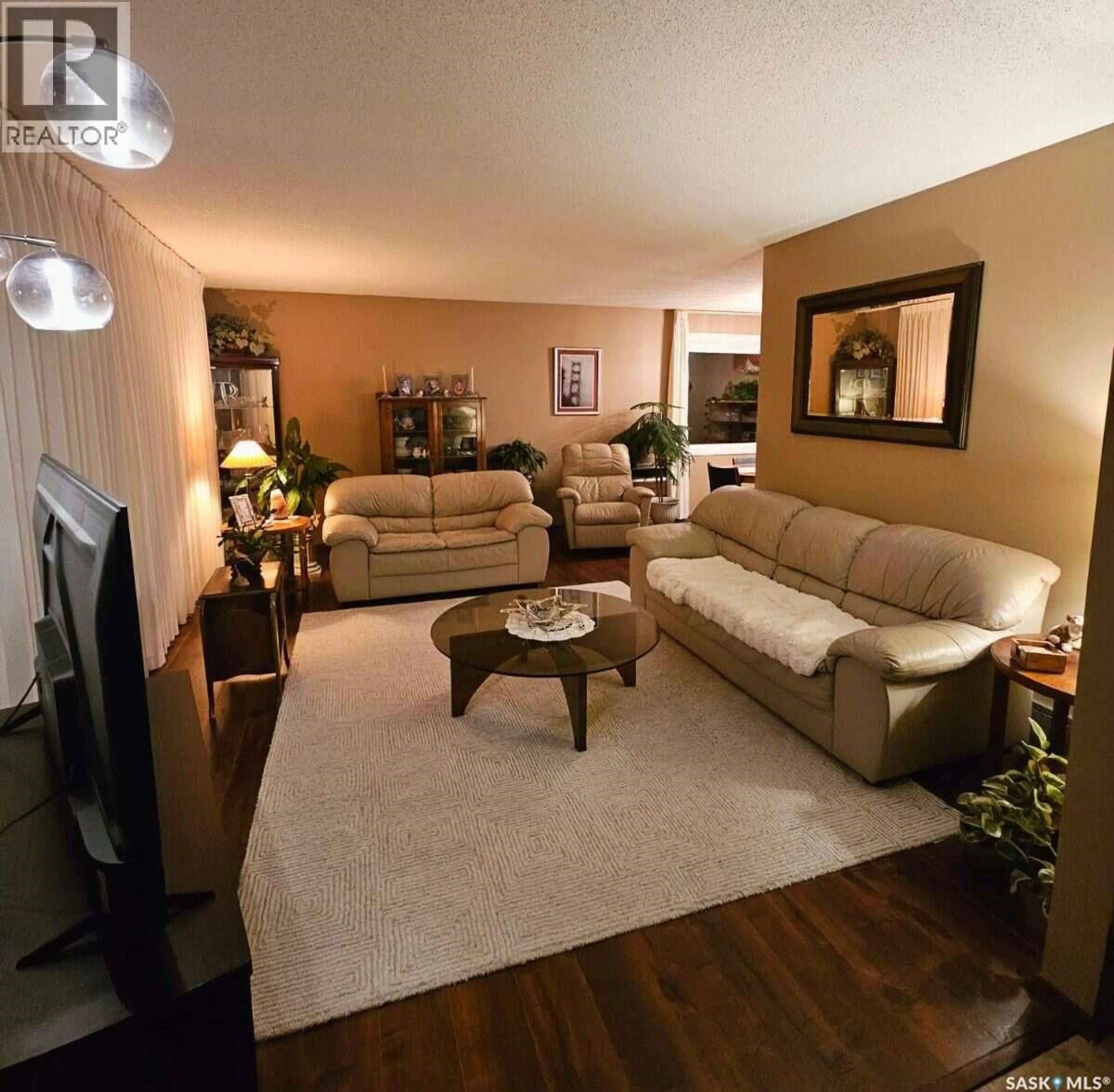 Living room with furniture, wood/laminate floor for 549 LAURIER DRIVE, Prince Albert Saskatchewan S6V5M4